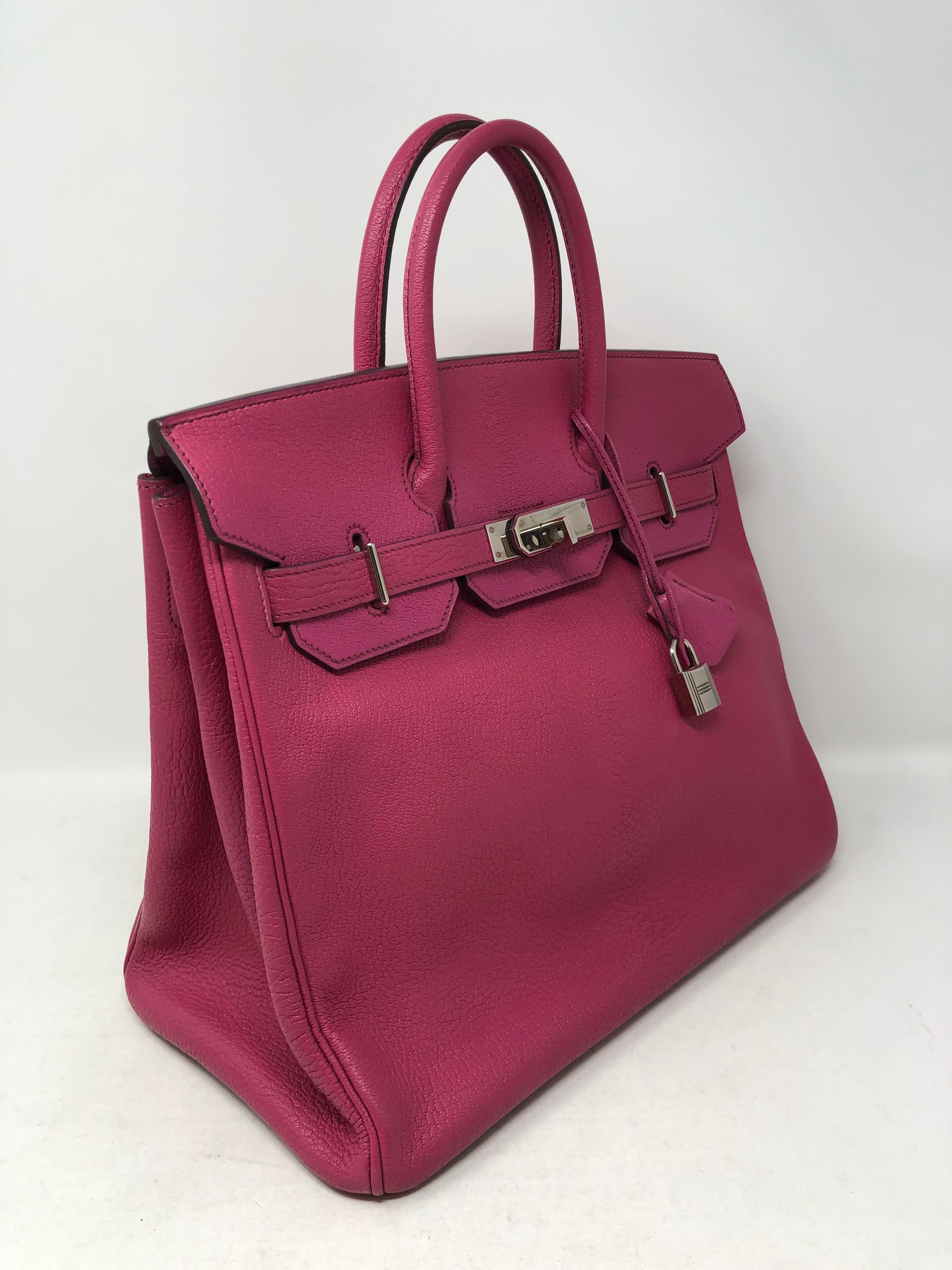 Hermes Birkin HAC 32 in Fuschia pink color. Hot pink color in Clemence leather. Palladium hardware. Good condition. Includes clochette, lock and keys. Original dust cover. Guaranteed authentic. 