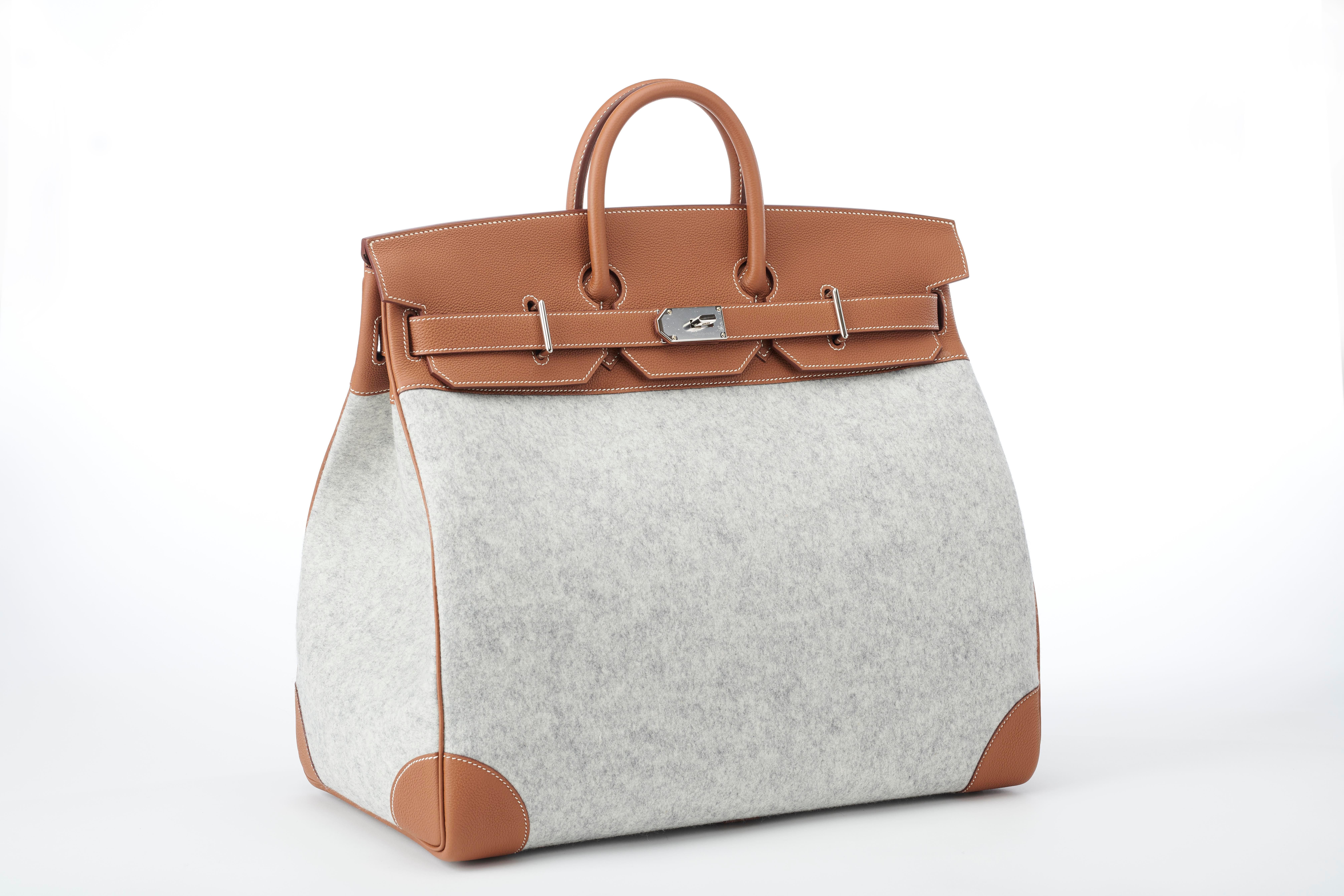 New, unworn limited edition Hermes Birkin HAC 50cm TODOO in Gold Togo leather and Gris Clair Wool Felt and palladum hardware.  

This bag is the perfect travel companion - the 50cm size makes it a practical and stylish carry on and the durable wool