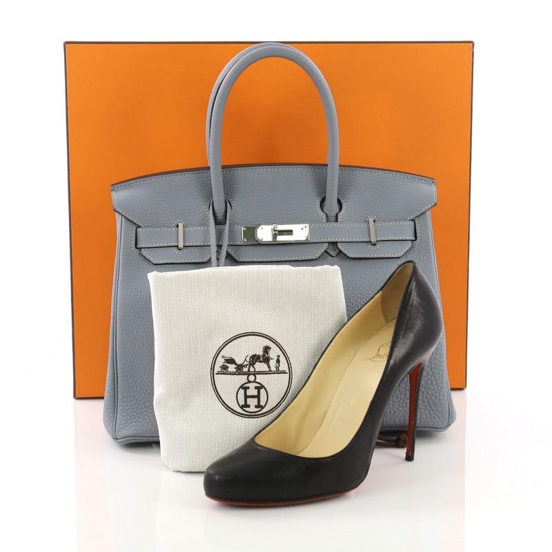 This Hermes Birkin Handbag Bleu Lin Fjord with Palladium Hardware 30, crafted from Bleu Lin Fjord leather, features dual rolled handles, front flap, and palladium hardware. Its turn-lock closure opens to a Bleu Lin Cherve leather interior with slip