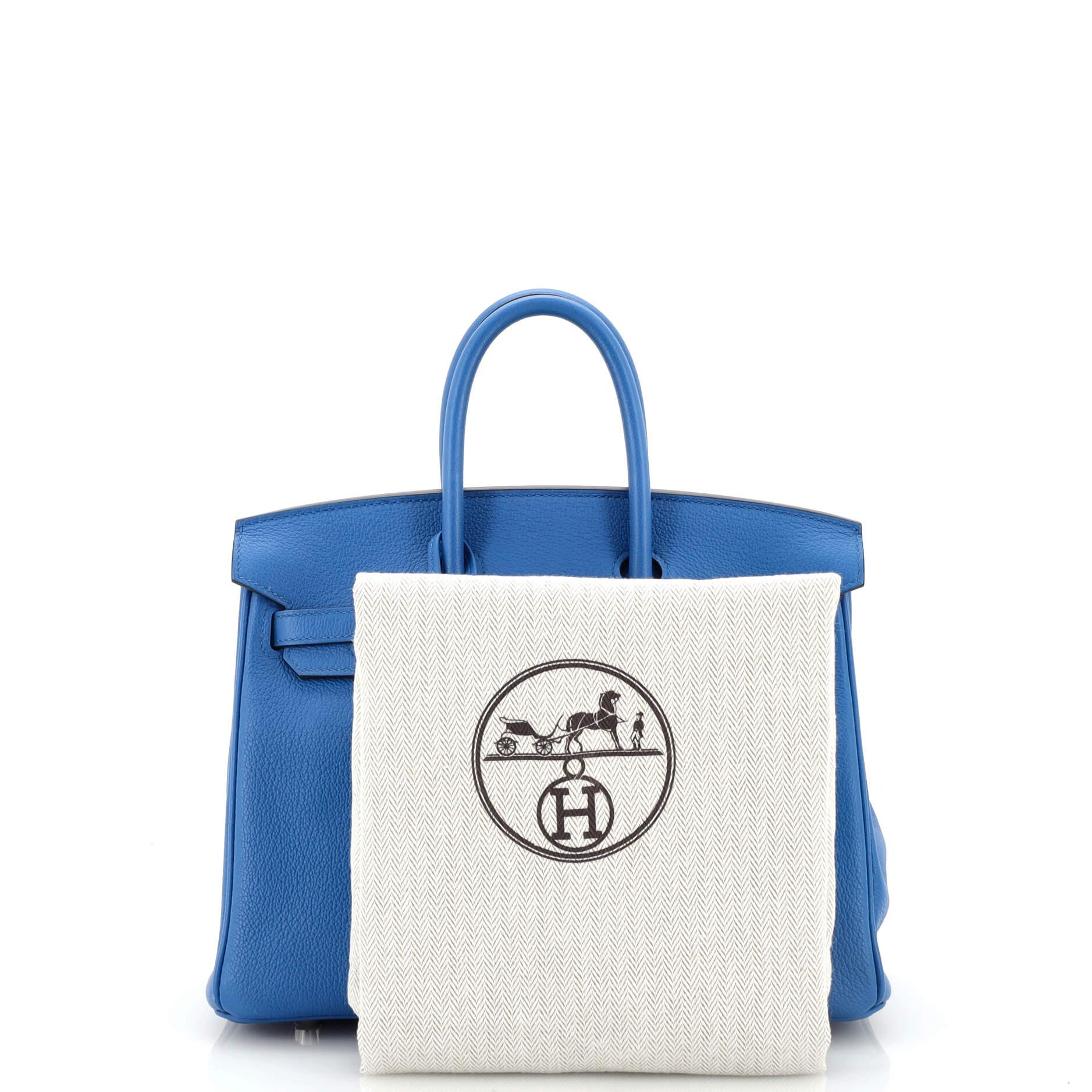 Condition: Great. Light wear and scuffs on exterior, handles and in interior, minor cracking on flap opening corner wax edges. Small indentations on interior base, scratches on hardware.
Accessories: Clochette, Keys, Dust Bag, Lock
Measurements: