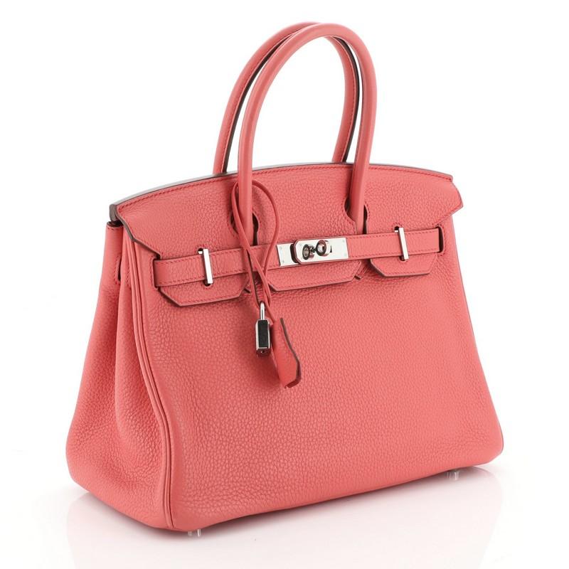 This Hermes Birkin Handbag Bougainvillea Clemence with Palladium Hardware 30, crafted in Bougainvillea red Clemence leather, features dual rolled handles, frontal flap, and palladium hardware. Its turn-lock closure opens to a Bougainvillea red