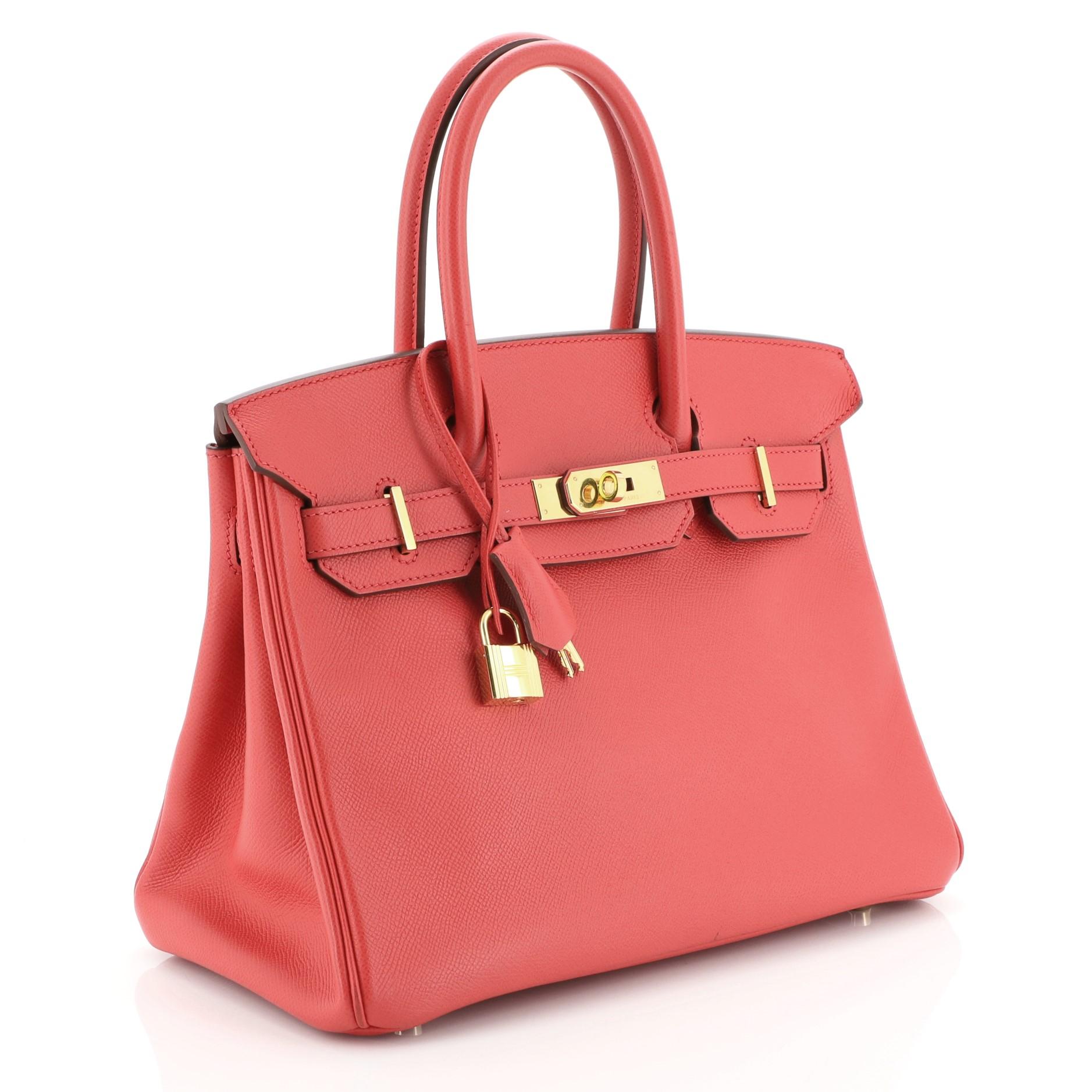 This Hermes Birkin Handbag Bougainvillea Epsom with Gold Hardware 30, crafted in Bougainvillea red Epsom leather, features dual rolled handles, frontal flap, and gold hardware. Its turn-lock closure opens to a Bougainvillea red Chevre leather