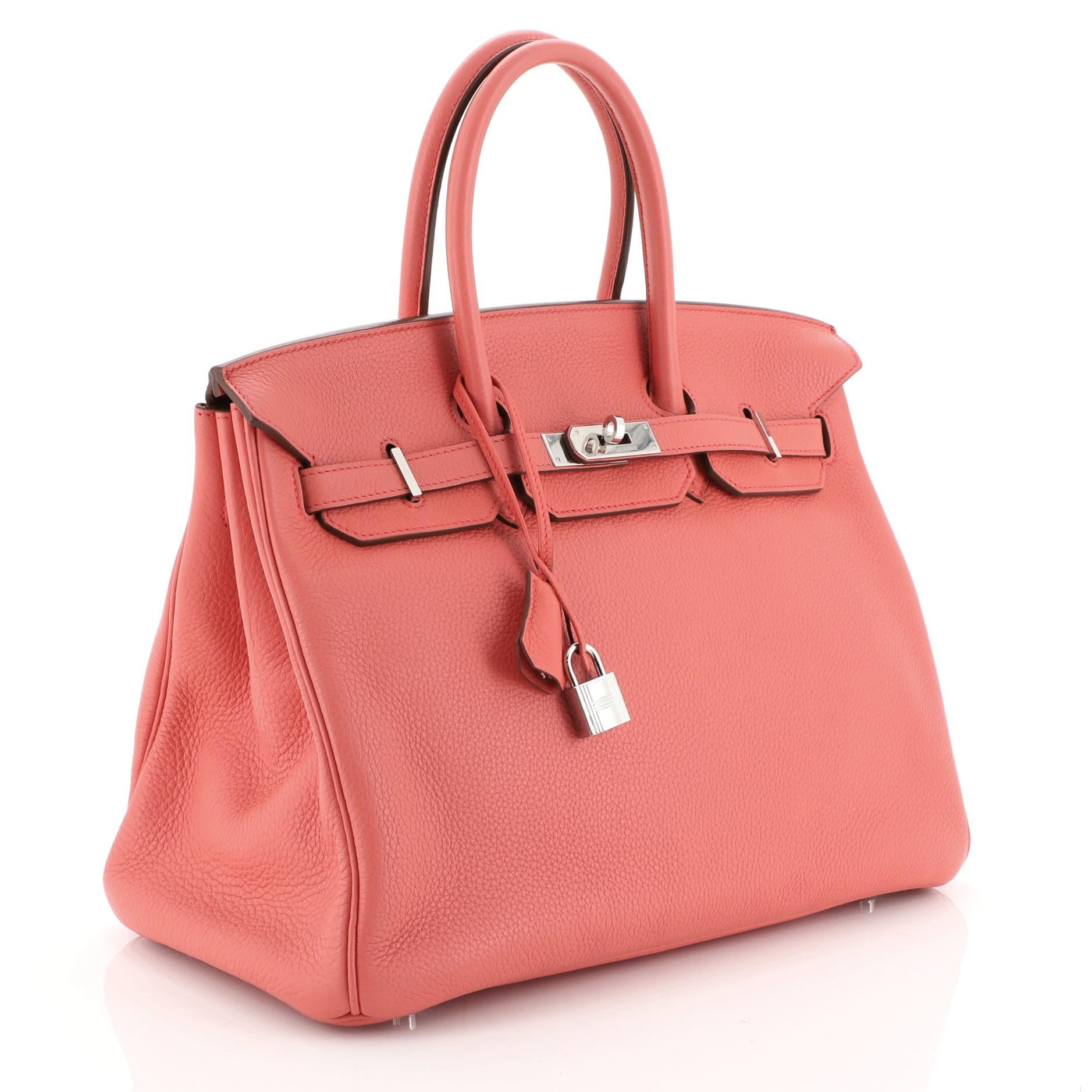 This Hermes Birkin Handbag Bougainvillier Clemence with Palladium Hardware 35, crafted in Bougainvillier Clemence leather, features dual rolled handles, frontal flap, and palladium hardware. Its turn-lock closure opens to a Bougainvillier Chevre