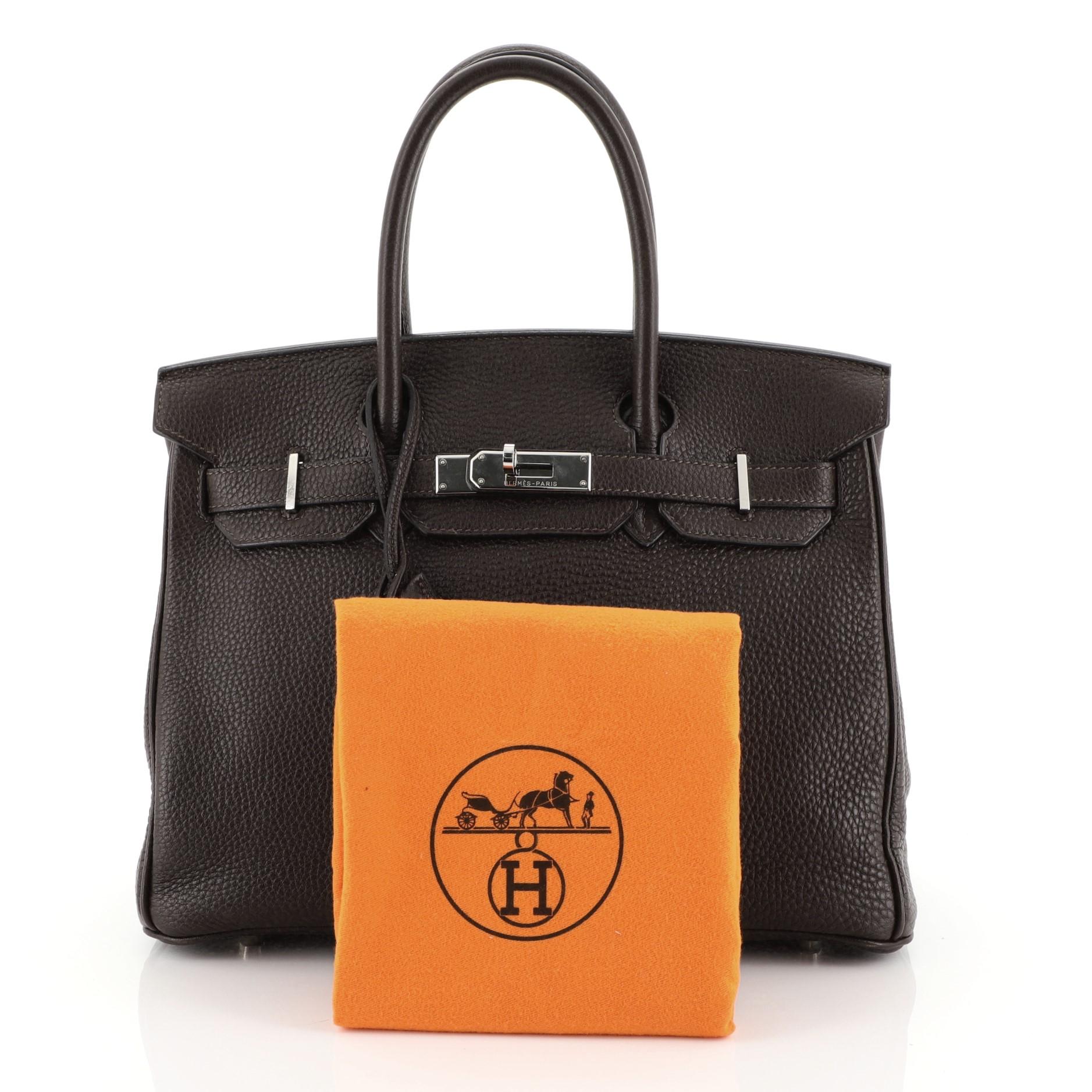 This Hermes Birkin Handbag Cafe Clemence with Palladium Hardware 30, crafted in Cafe brown clemence leather, features dual rolled handles, front flap, and palladium hardware. Its turn-lock closure opens to a Cafe brown leather interior with slip and