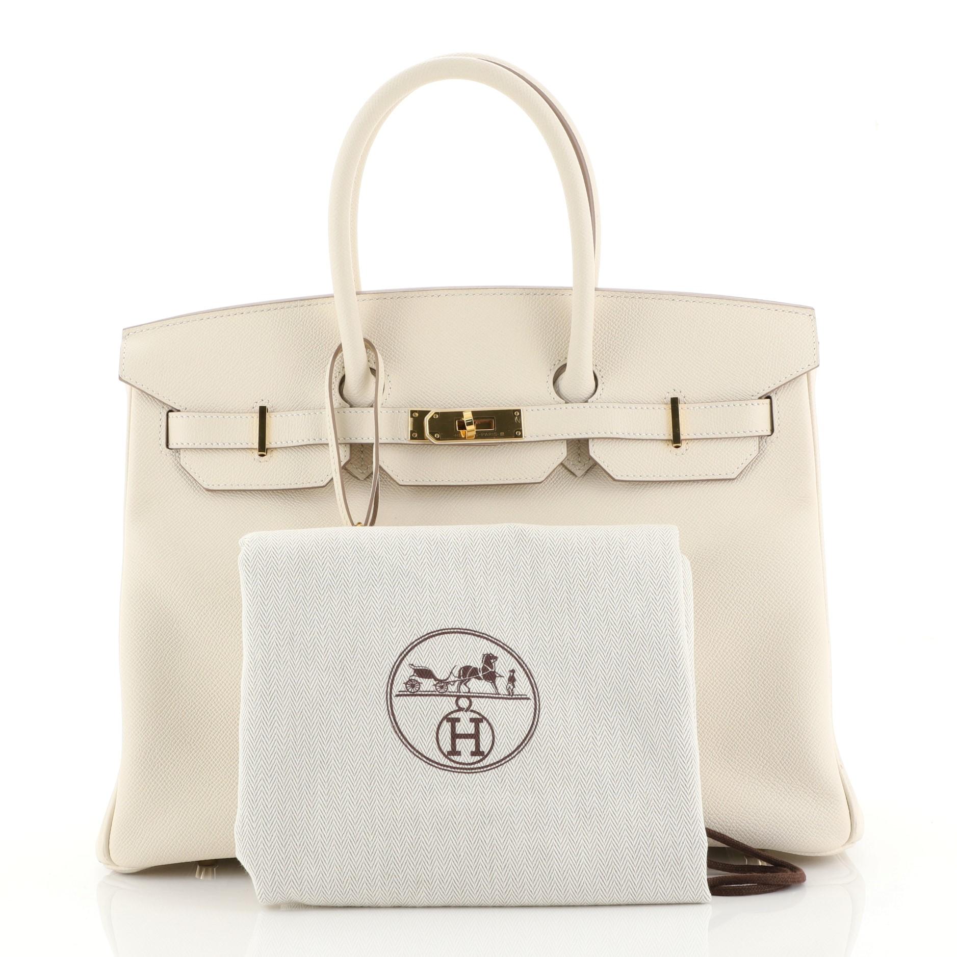 This Hermes Birkin Handbag Craie Epsom with Gold Hardware 35, crafted in Craie white Epsom leather, features dual rolled handles, frontal flap, and gold hardware. Its turn-lock closure opens to a Craie white Chevre leather interior with zip and slip