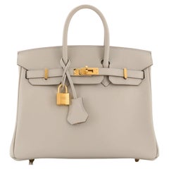 Hermès Birkin Handtasche Grau Swift mit Goldbeschlägen 25