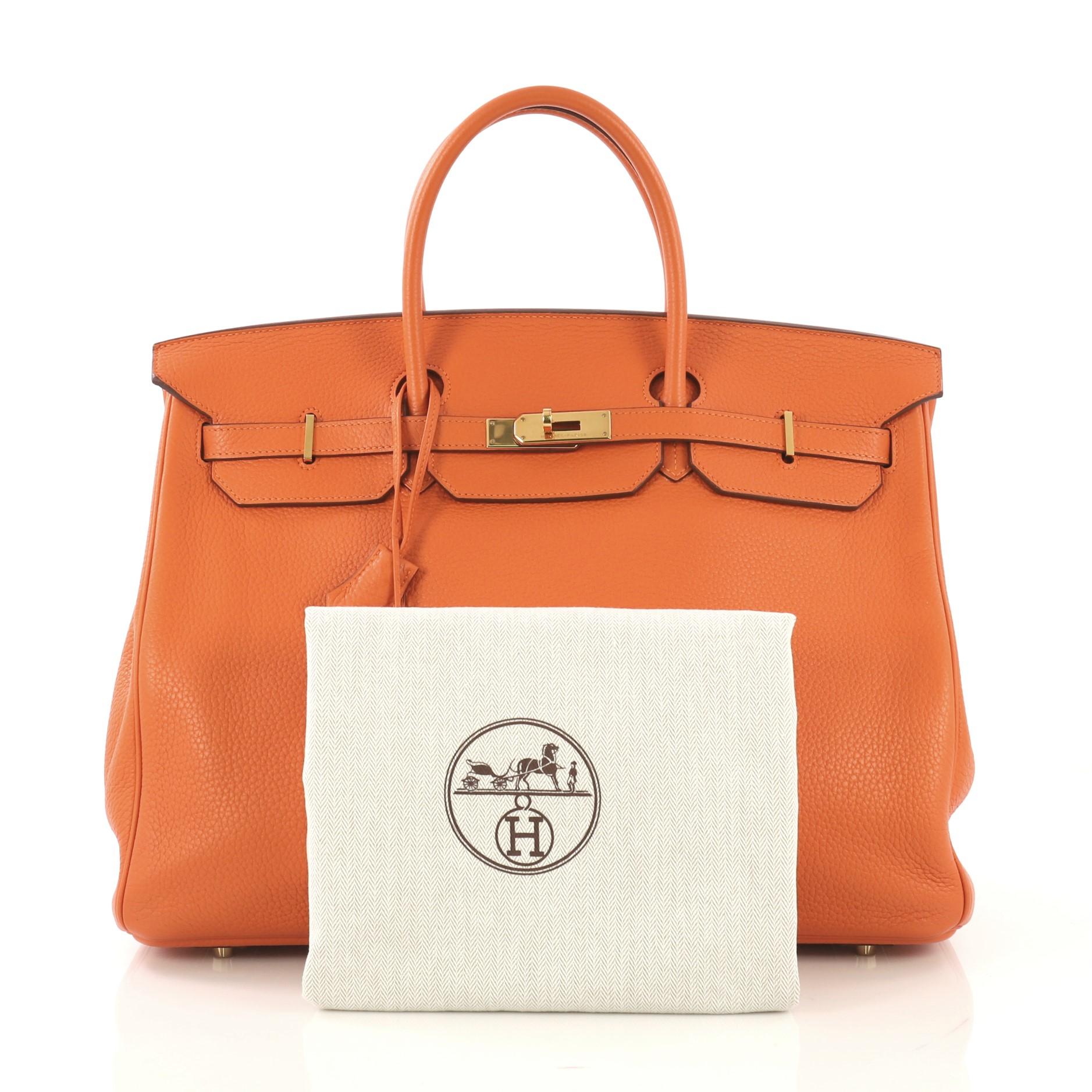  This Hermes Birkin Handbag Orange H Clemence with Gold Hardware 40, crafted in Orange H orange clemence leather, features dual rolled handles, frontal flap, and gold hardware. Its turn-lock closure opens to an Orange H orange clemence leather