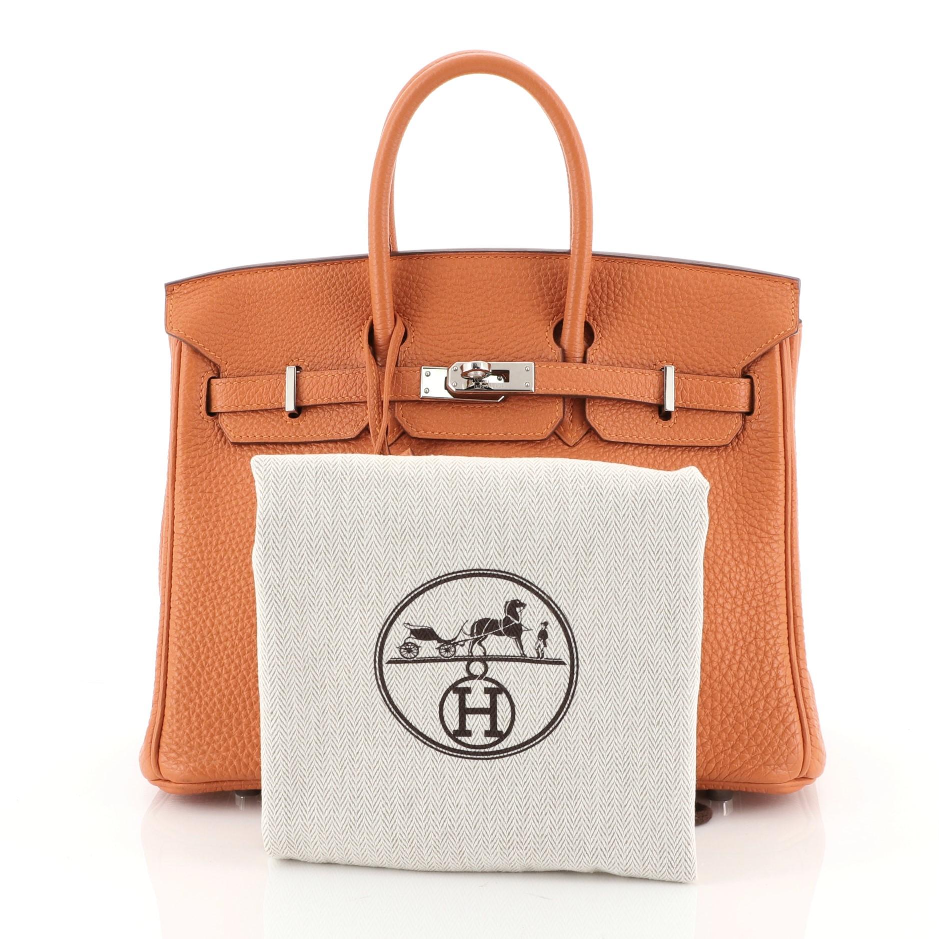 This Hermes Birkin Handbag Orange H Clemence with Palladium Hardware 25, crafted in Orange H orange Clemence leather, features dual rolled handles, frontal flap, and palladium hardware. Its turn-lock closure opens to an Orange H orange Chevre