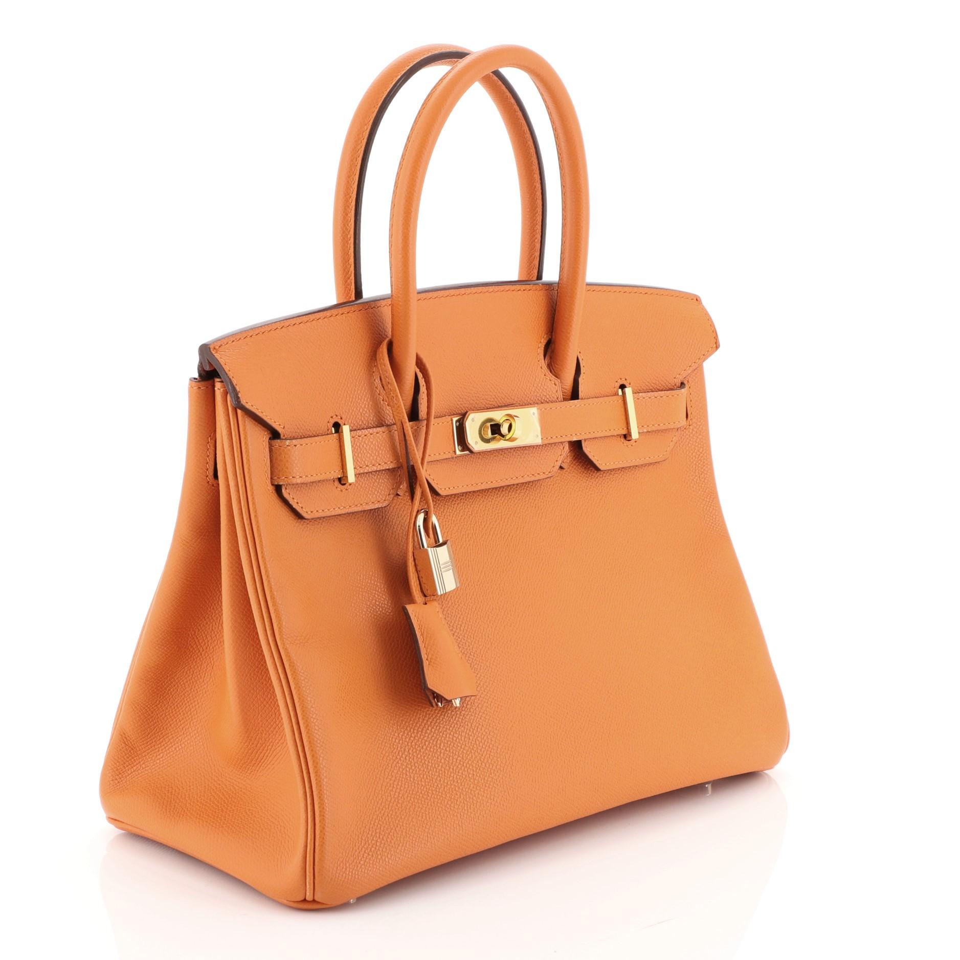 This Hermes Birkin Handbag Orange H Epsom with Gold Hardware 30, crafted in Orange H orange Epsom leather, features dual rolled handles, frontal flap, and gold hardware. Its turn-lock closure opens to an Orange H orange Chevre leather interior with
