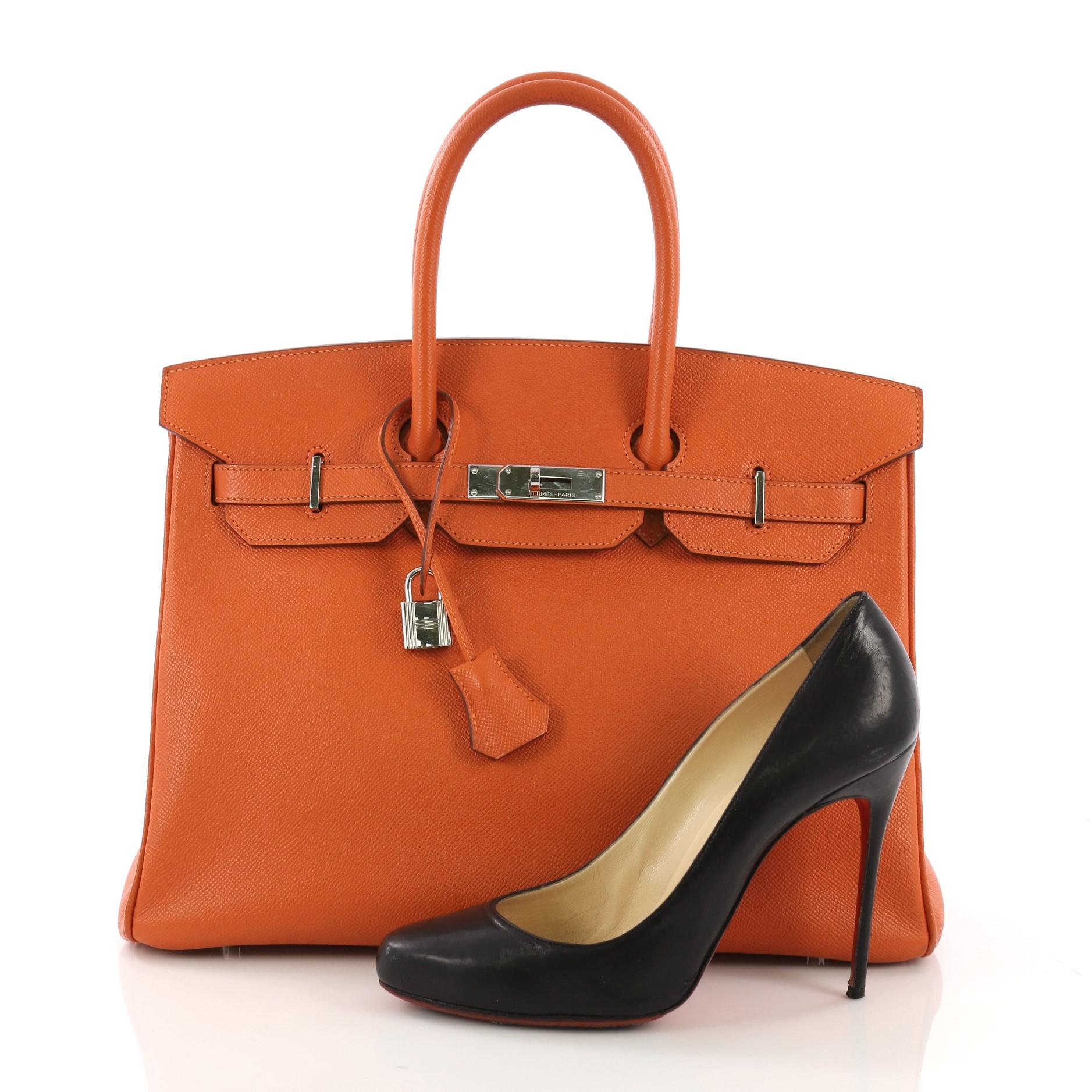 This Hermes Birkin 35, crafted in Orange H Epsom leather, features dual rolled top handles, frontal flap, and palladium hardware. Its turn-lock closure opens to an Orange H Chevre leather interior with zip and slip pockets. Date stamp reads: O