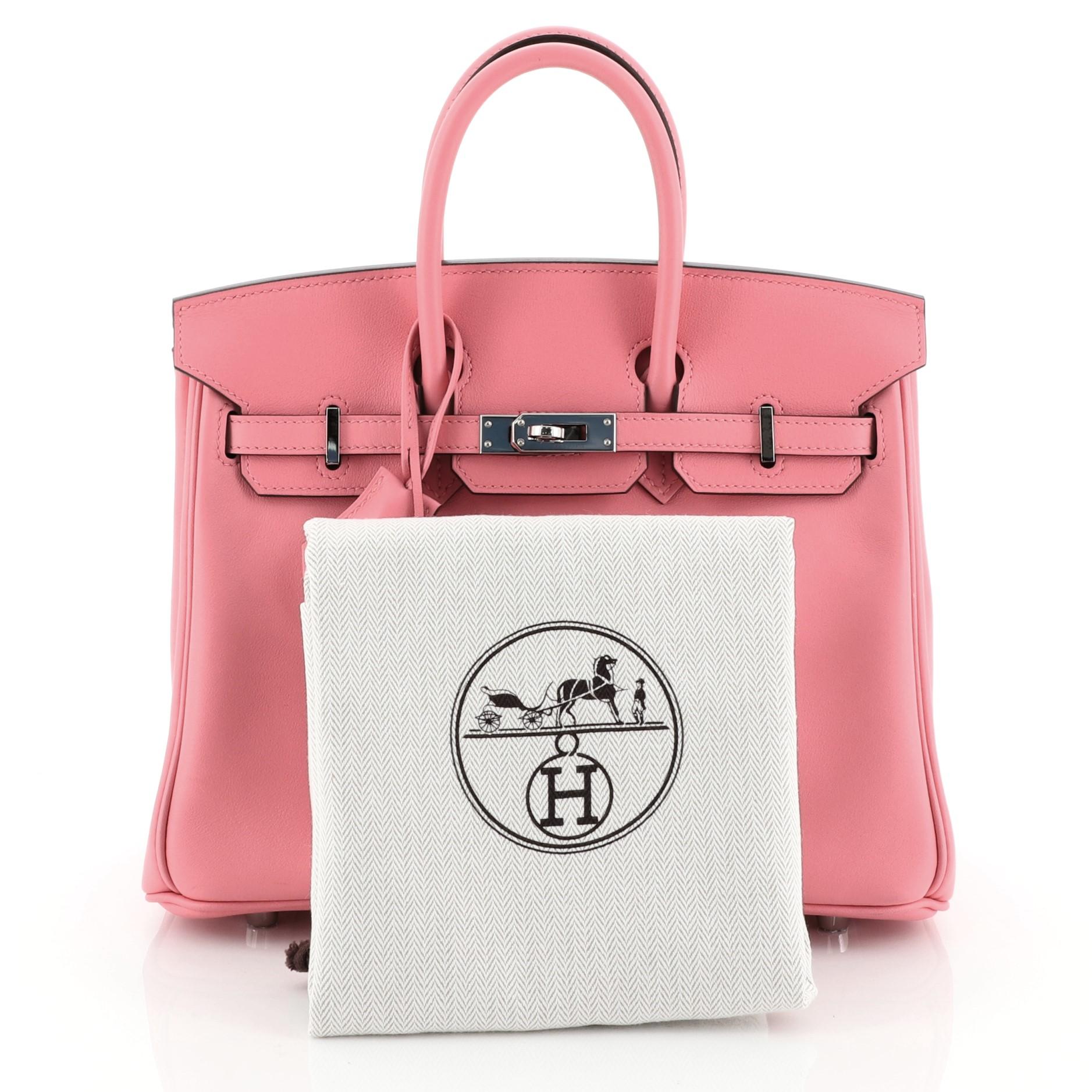 This Hermes Birkin Handbag Rose Azalee Swift with Palladium Hardware 25, crafted in Rose Azalee pink Swift leather, features dual rolled top handles, frontal flap, and palladium hardware. Its turn-lock closure opens to a Rose Azalee pink Swift