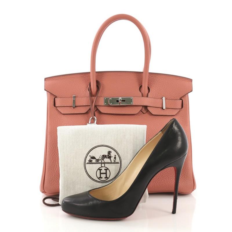 This Hermes Birkin Handbag Rose Tea Clemence with Palladium Hardware 30, crafted in Rose Tea pink Clemence leather, features dual rolled top handles, frontal flap, and palladium hardware. Its turn-lock closure opens to a Rose Tea pink Chevre leather