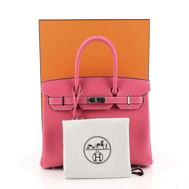 This Hermes Birkin Handbag Rose Tyrien Epsom with Palladium Hardware 30, crafted in Rose Tyrien pink Epsom leather, features dual rolled handles, frontal flap, and palladium hardware. Its turn-lock closure opens to a Rose Tyrien pink Chevre leather