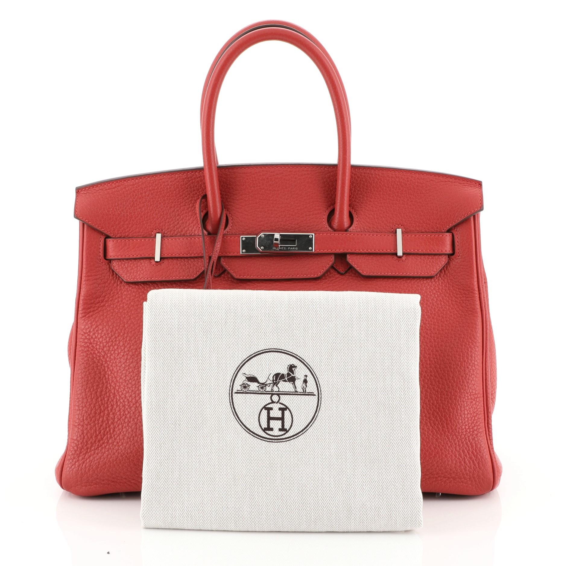 This Hermes Birkin Handbag Rouge Casaque Clemence with Palladium Hardware 35, crafted in Rouge Casaque red Clemence leather, features dual rolled handles, frontal flap, and palladium hardware. Its turn-lock closure opens to a Rouge Casaque red