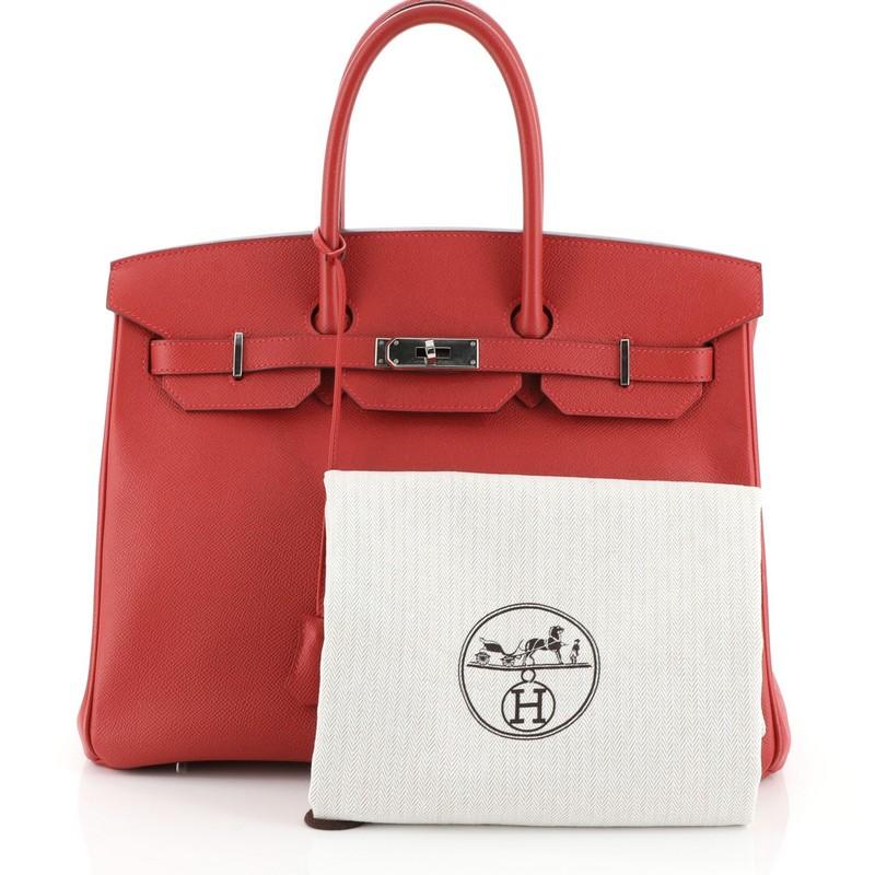 
This Hermes Birkin Handbag Rouge Casaque Epsom with Palladium Hardware 35, crafted in Rouge Casaque red Epsom leather, features dual rolled top handles, frontal flap, and palladium hardware. Its turn-lock closure opens to a Rouge Casaque red Chevre