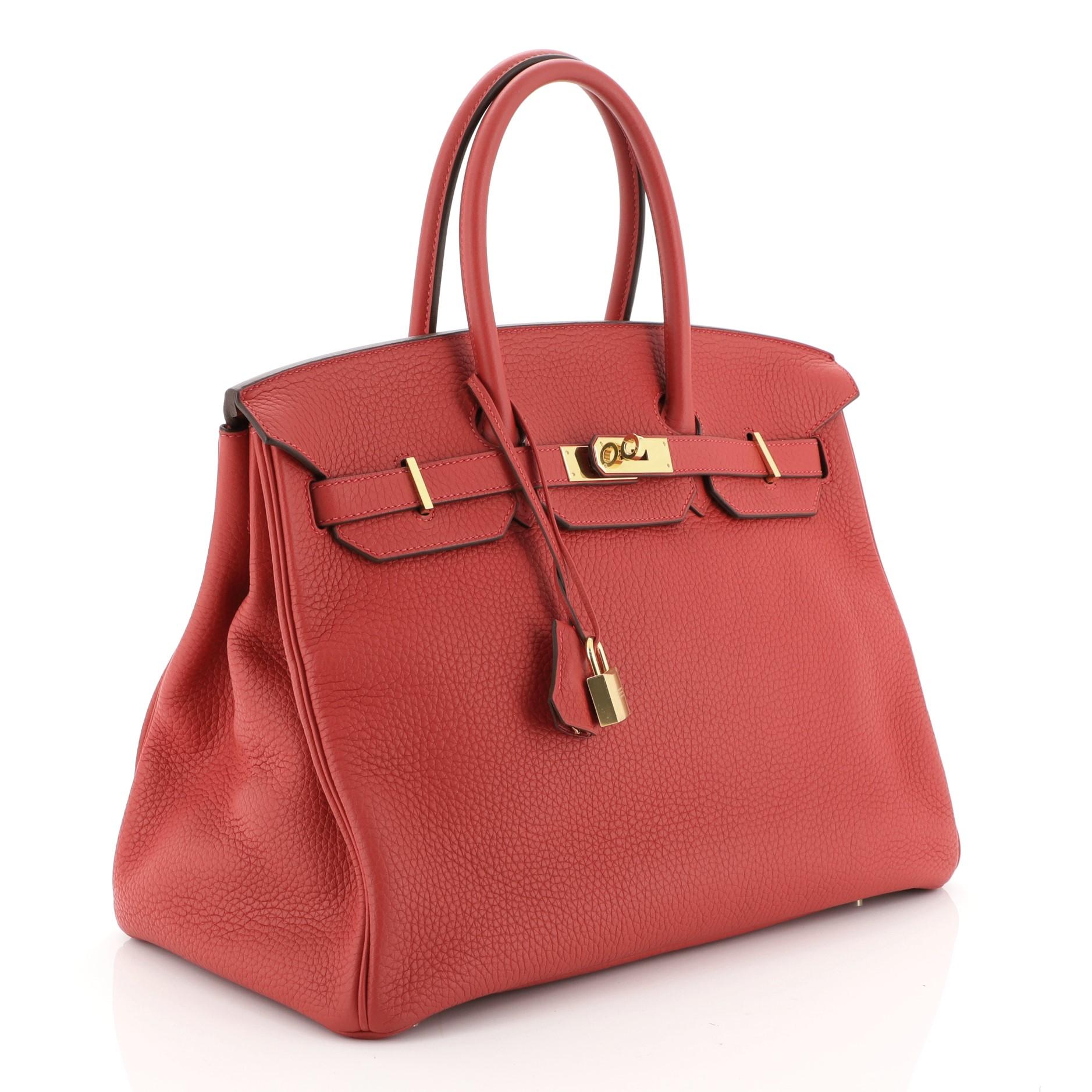 This Hermes Birkin Handbag Rouge Vif Clemence with Gold Hardware 35, crafted in Rouge Vif red Clemence leather, features dual rolled handles, frontal flap, and gold hardware. Its turn-lock closure opens to a Rouge Vif red Chevre leather interior