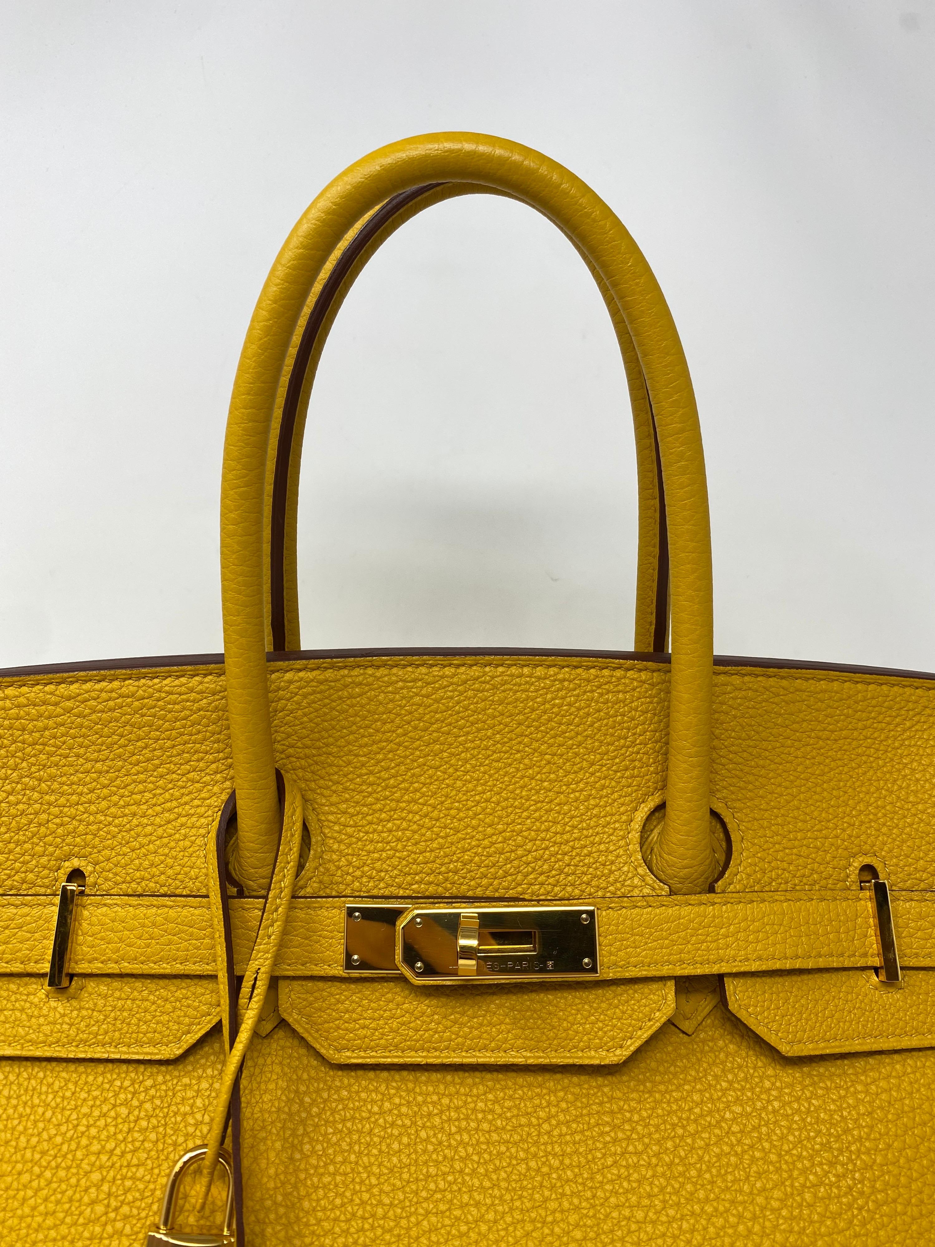 Hermes Jaune Birkin 35 Bag. The sun Jaune yellow color in togo leather. Gold hardware. Excellent condition. Hard to find combo. Great investment bag. Includes clochette, lock, keys, and dust cover. Guaranteed authentic. 