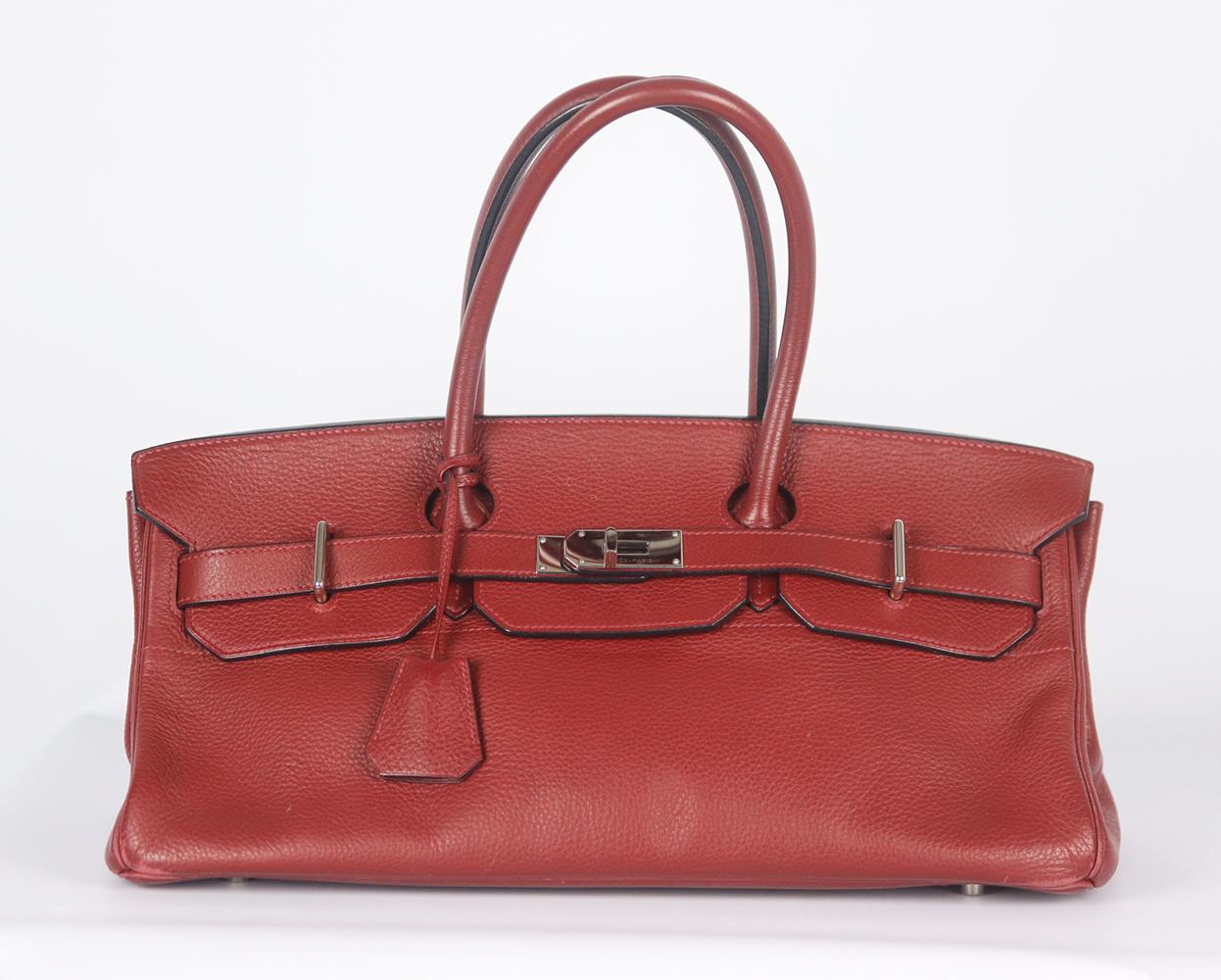 This Hermès Birkin JPG Clemence Shoulder Bag with Palladium hardware and double rolled shoulder strap in red tonal leather in colour Rouge H. 
Red leather.
Twist lock fastening at front.
Does not come with dustbag and padlock.

Dimensions: W 42 x H
