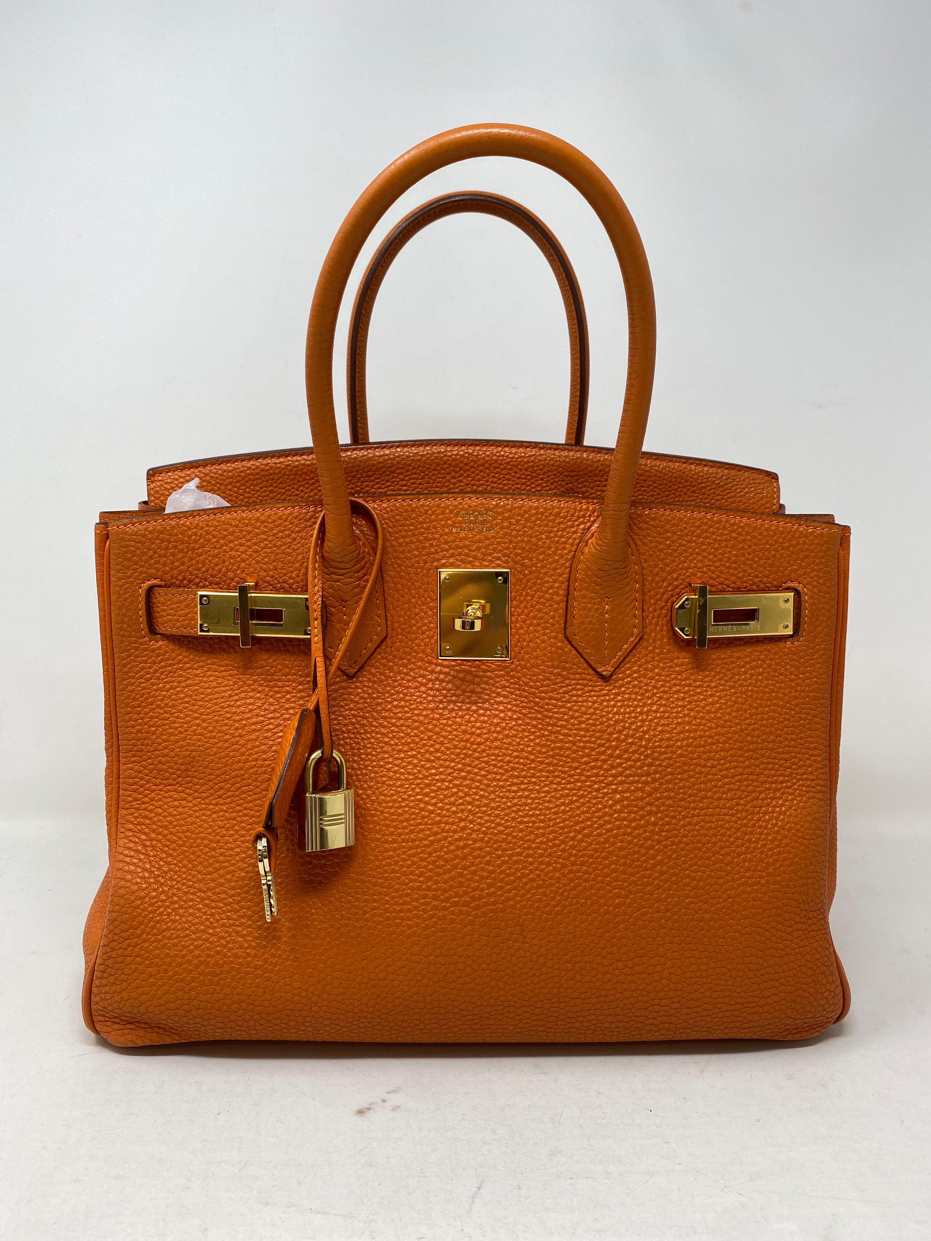 Hermes Birkin 30 Orange Bag. Togo leather. Gold hardware. Most wanted color combo and hard size to find 30. Good condition. Includes clochette, lock, keys, and dust cover. Guaranteed authentic. 