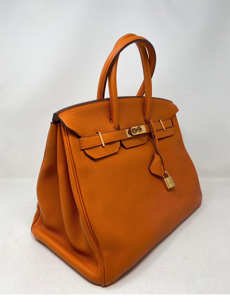 Hermes Birkin Orange 35 Bag. Gold hardware. Good condition. Light wear on corners. Please see photos. Includes clochette, lock, keys, and dust cover. Guaranteed authentic. 