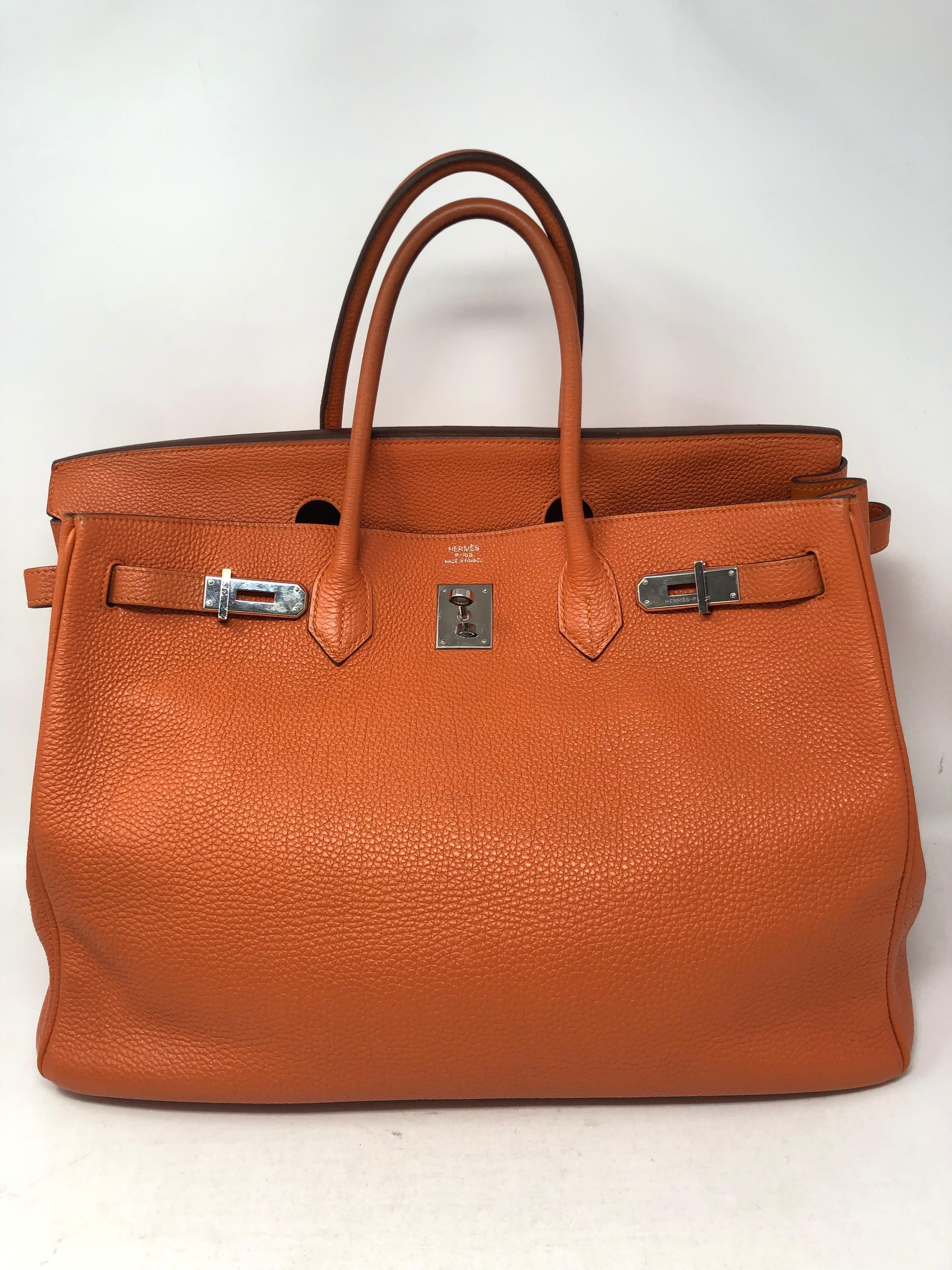 Hermes Orange Birkin 40 palladium hardware. Celebrity owned. Hard to get size 40. Great to hold all your essentials. Includes clochette, lock and keys. Don't miss out on this one. Guaranteed authentic. 