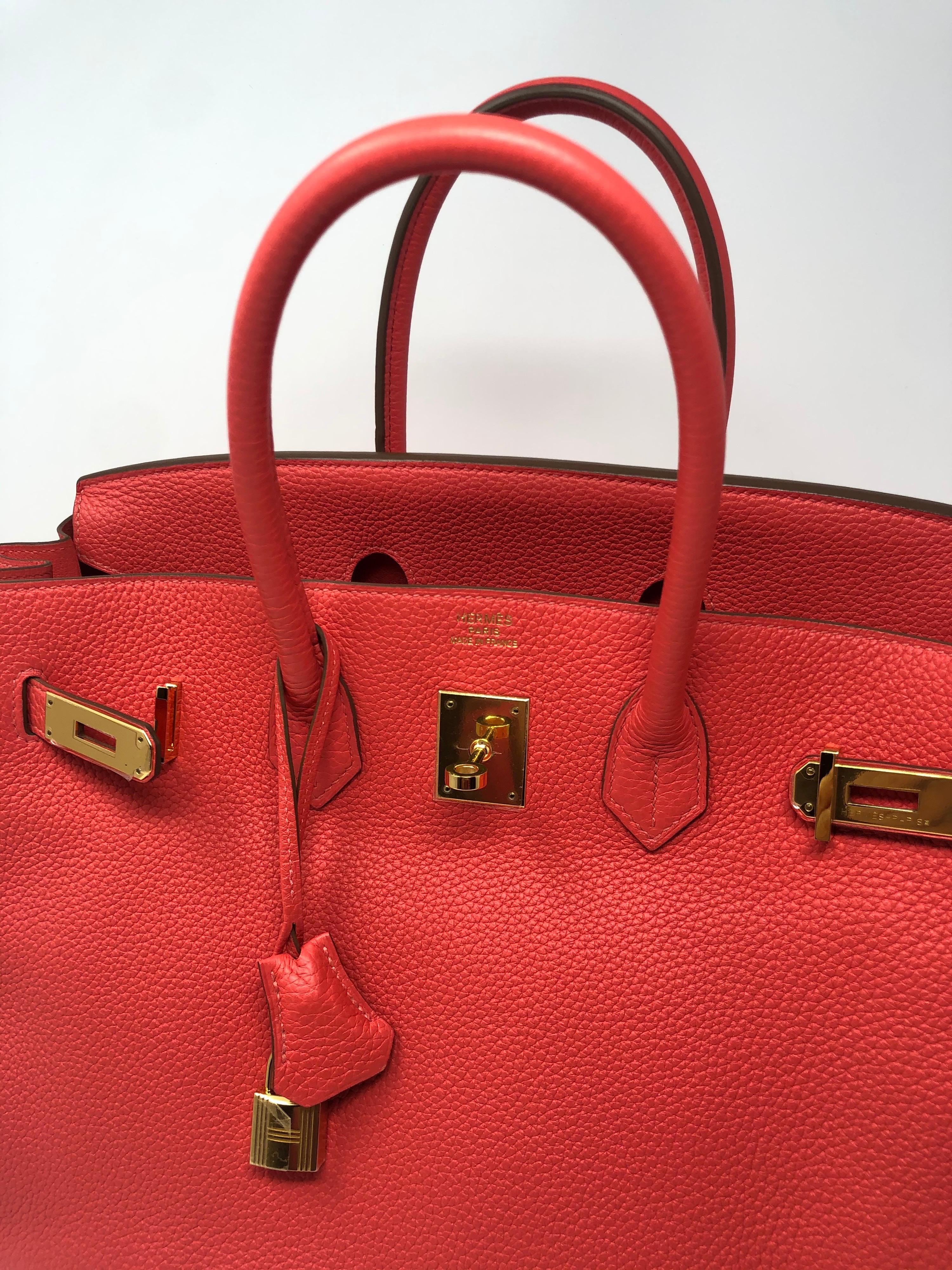 Hermes Birkin Rouge Pivone 35. Gold hardware. Mint like brand new condition. Plastic still on hardware. R stamp from 2014. One of the newest shades of red from Hermes. It is a rosy pink/ red salmon color. Vibrant and beautiful. Don't miss out on