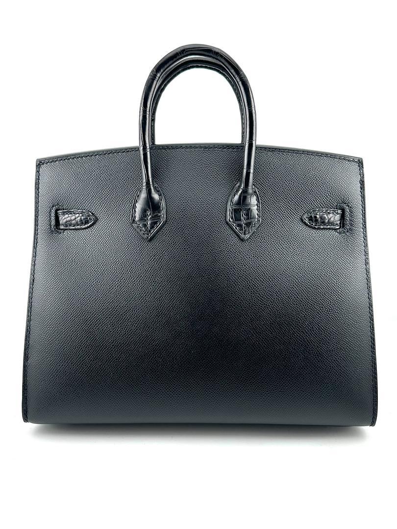 Jewels Aficionado offers the Hermès Birkin Sellier 20 Faubourg by Night, a rare and exquisite masterpiece. Crafted in Madame and shiny Alligator leather, this highly coveted design captures the essence of Paris at night with its striking details and