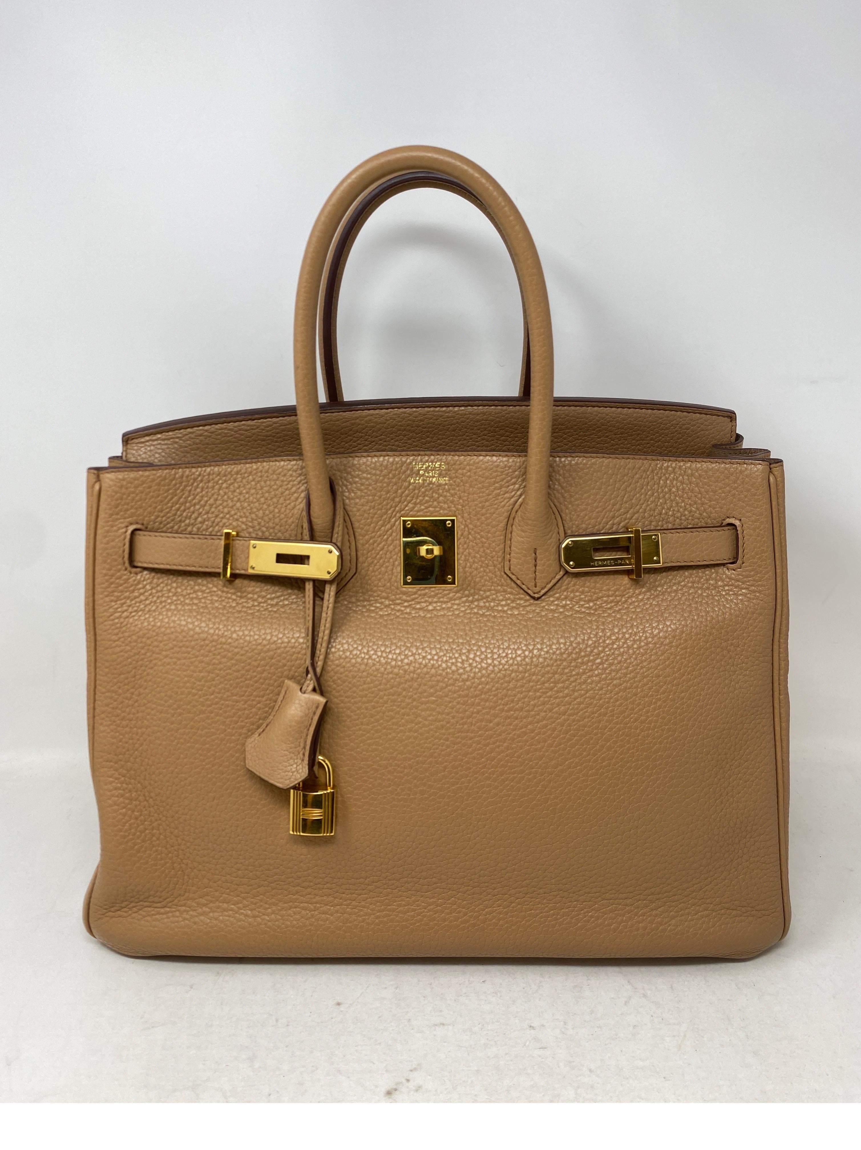 Hermes Birkin Tabac 35 Bag. Rare light tan color Birkin. Clemence leather. Gold hardware. Good condition. Interior clean. Includes clochette, lock, keys, and dust cover. Guaranteed authentic. 