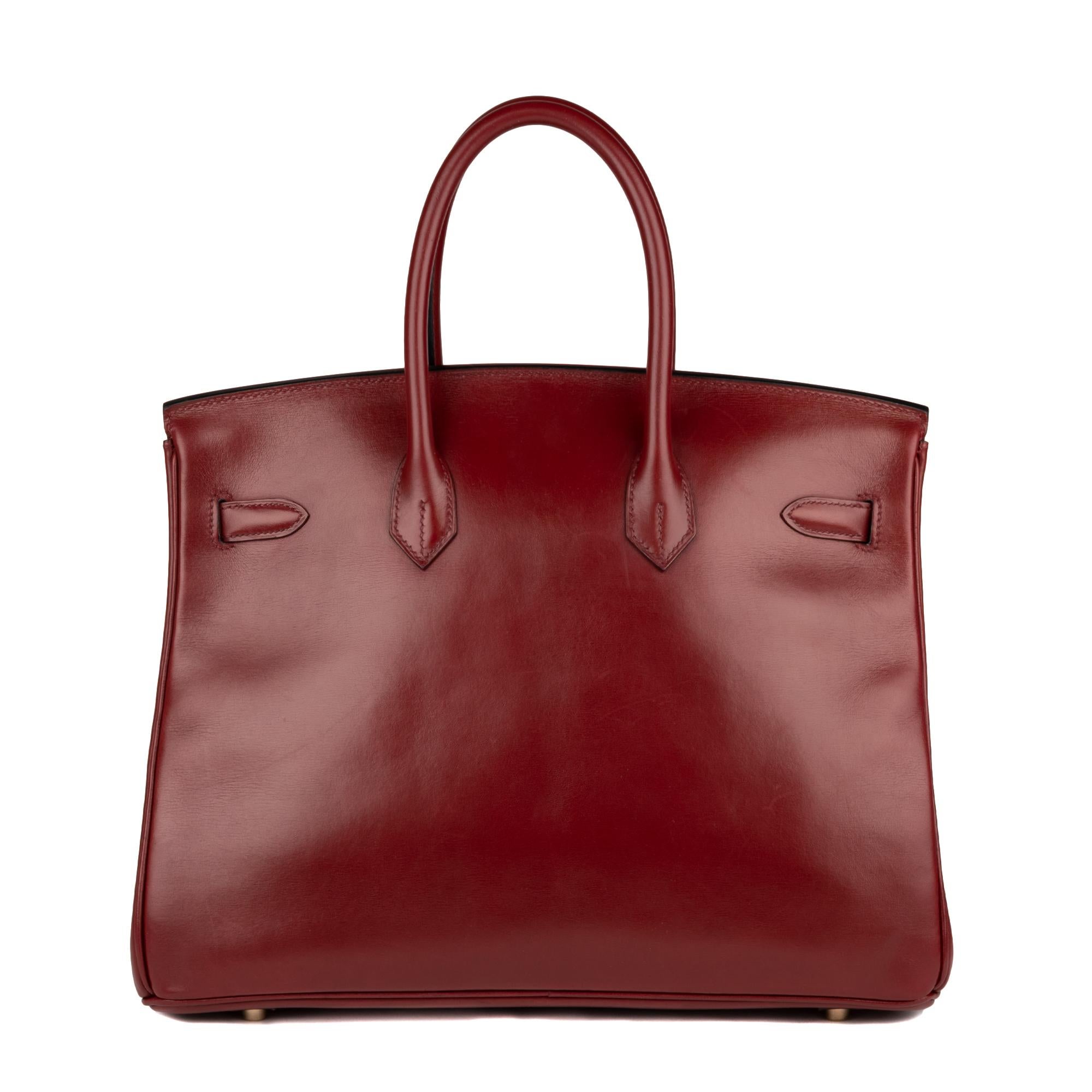 Exceptional Hermes Birkin bag 35 cm in burgundy box leather, gold plated metal hardware, double handle in burgundy leather allowing a hand carried.  Flap closure.  Inner lining in burgundy leather, one zipped pocket, one patch pocket.  
Sold with