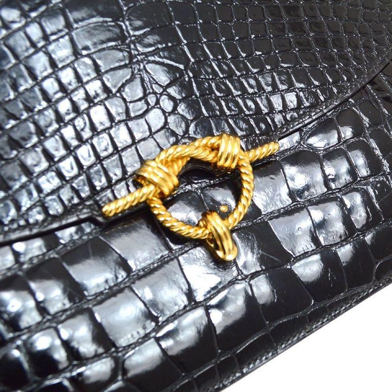 Pre-Owned Vintage Condition
From 1990 Collection
Crocodile 
Leather Trim
Gold Tone Hardware
Made in France
Measures 11