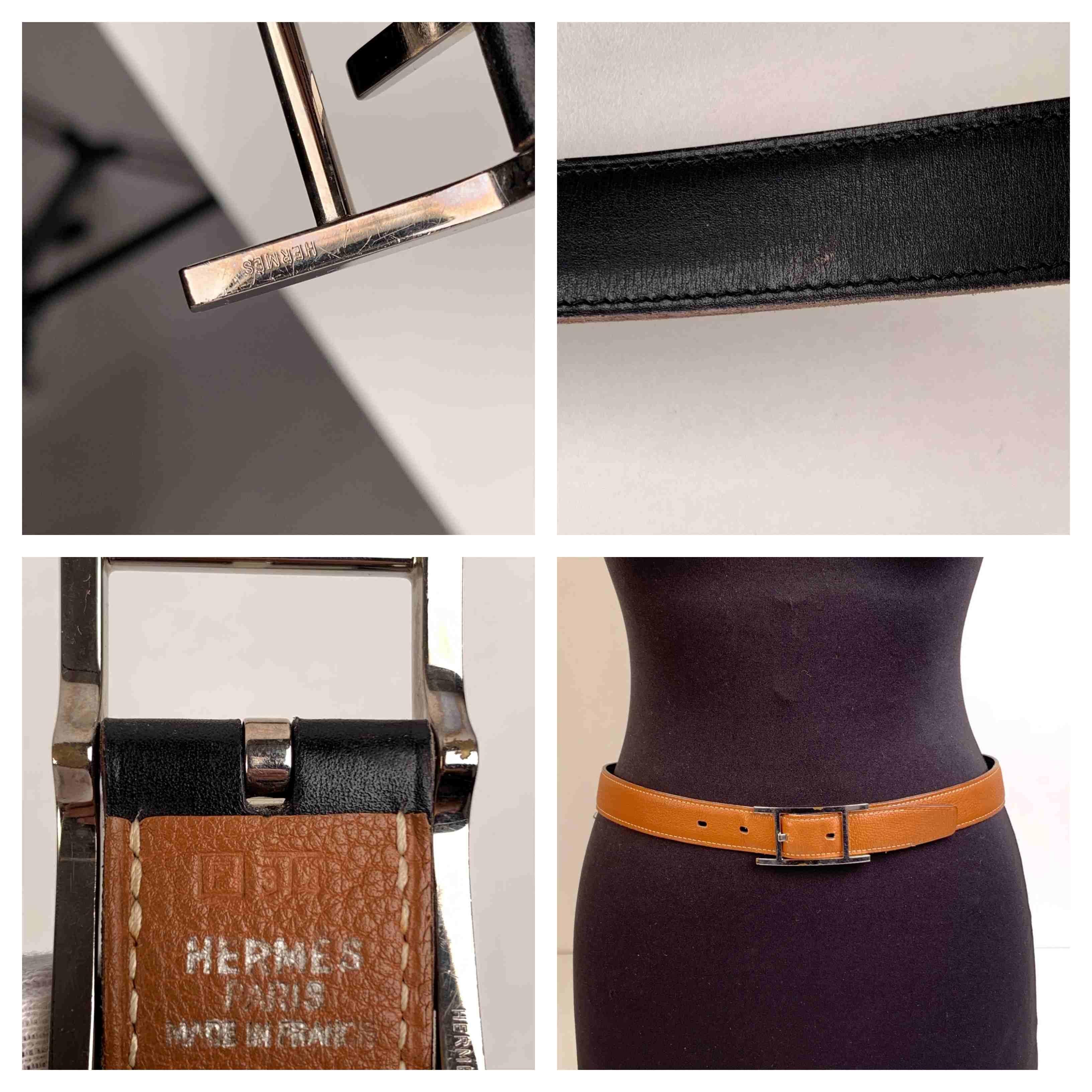Hermes reversible 'Hapi' belt with H palladium buckle. 4 holes adjustment. Black box calfskin leather on a side and tan pebbled leather on the other side. Signed 'Hermes Paris - Made in France' on the leather. Blindstamp is a 'F' encased in a square