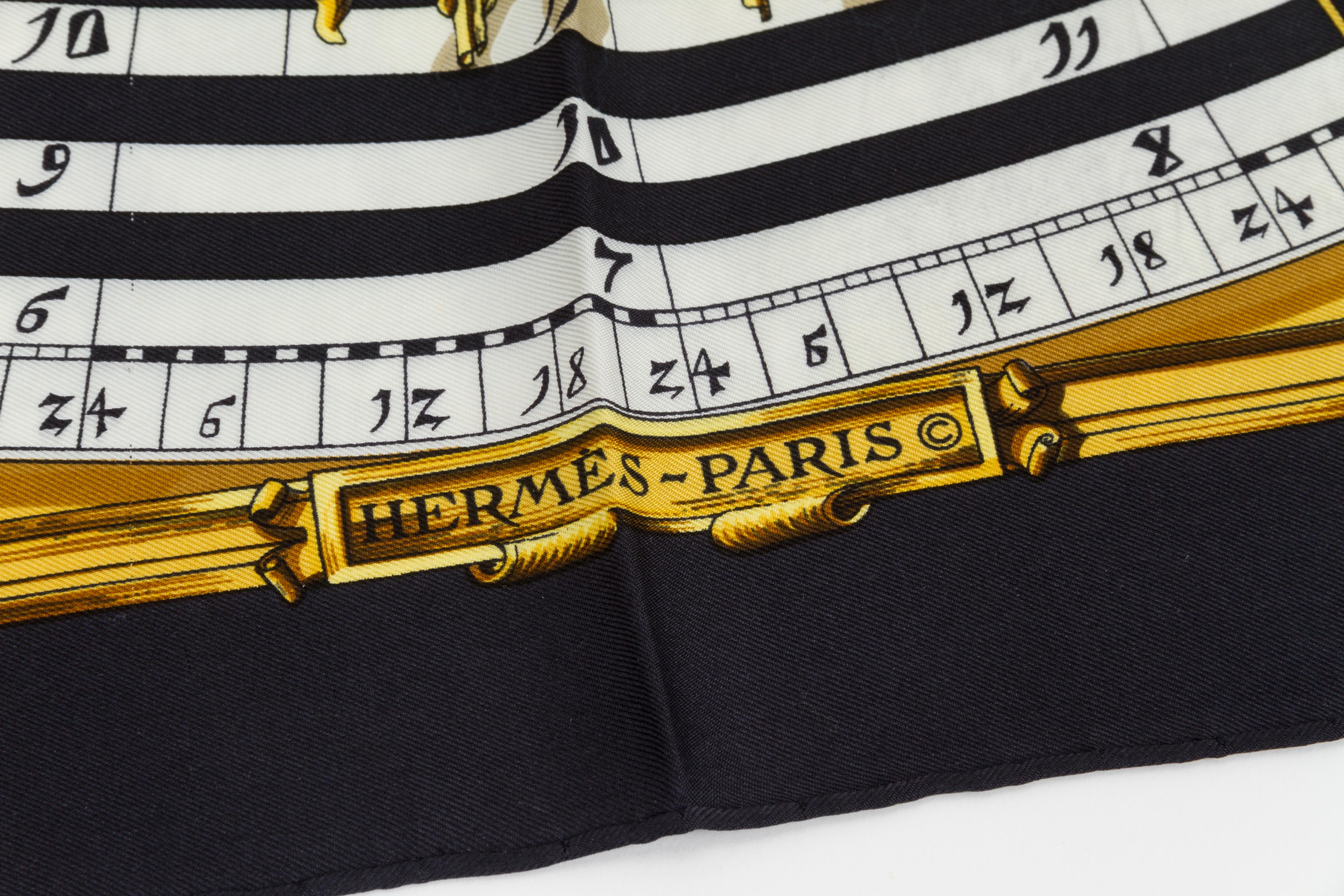 Hermes silk twill Astrologie scarf in black with white and gold accents. Hand-rolled edges. Minor wear.