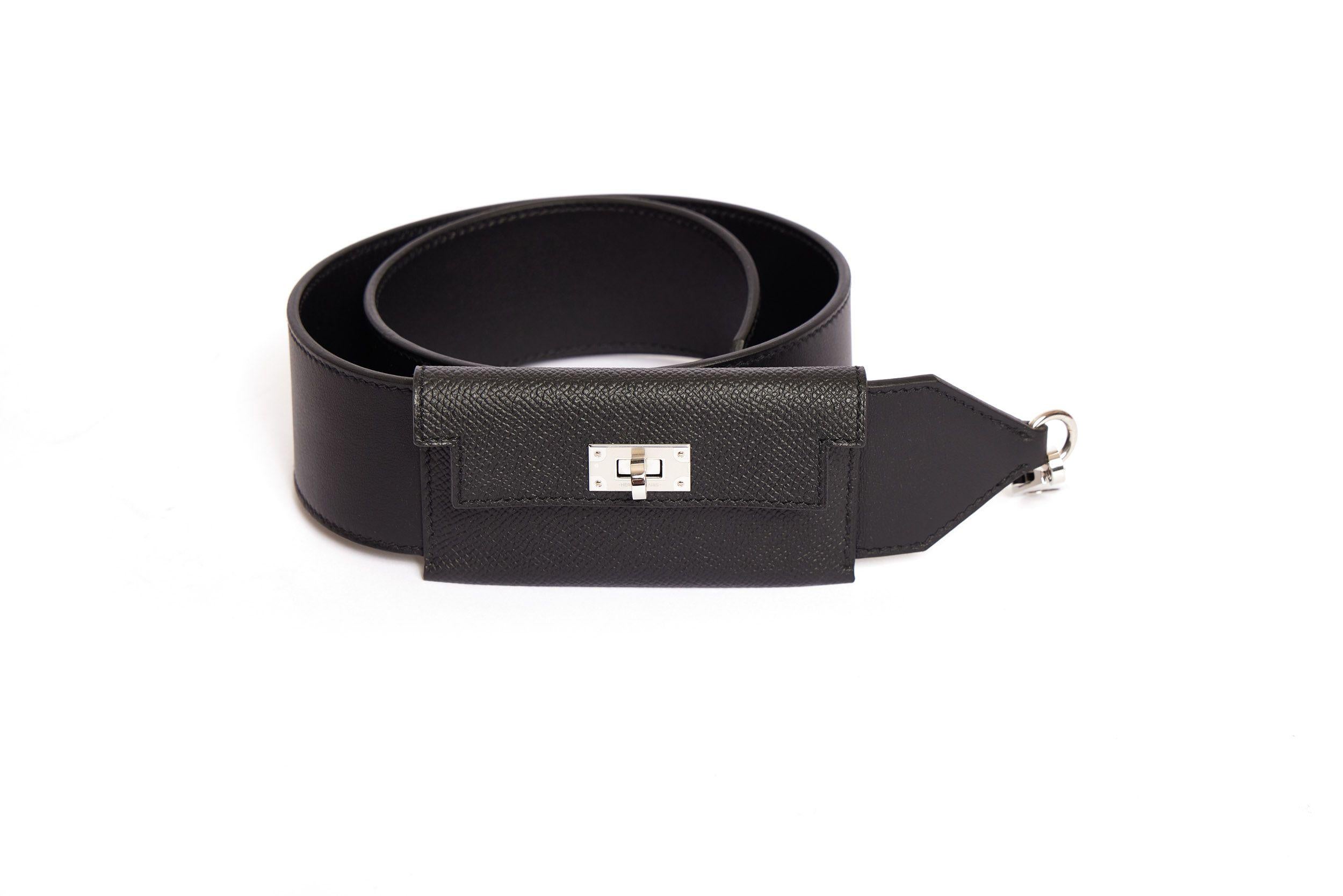 New Hermes Bandouliere Kelly black leather shoulder strap. Black leather pocket with palladium metal closure. Comes with booklet, original box and dust cover Pocket dimensions: 4.30