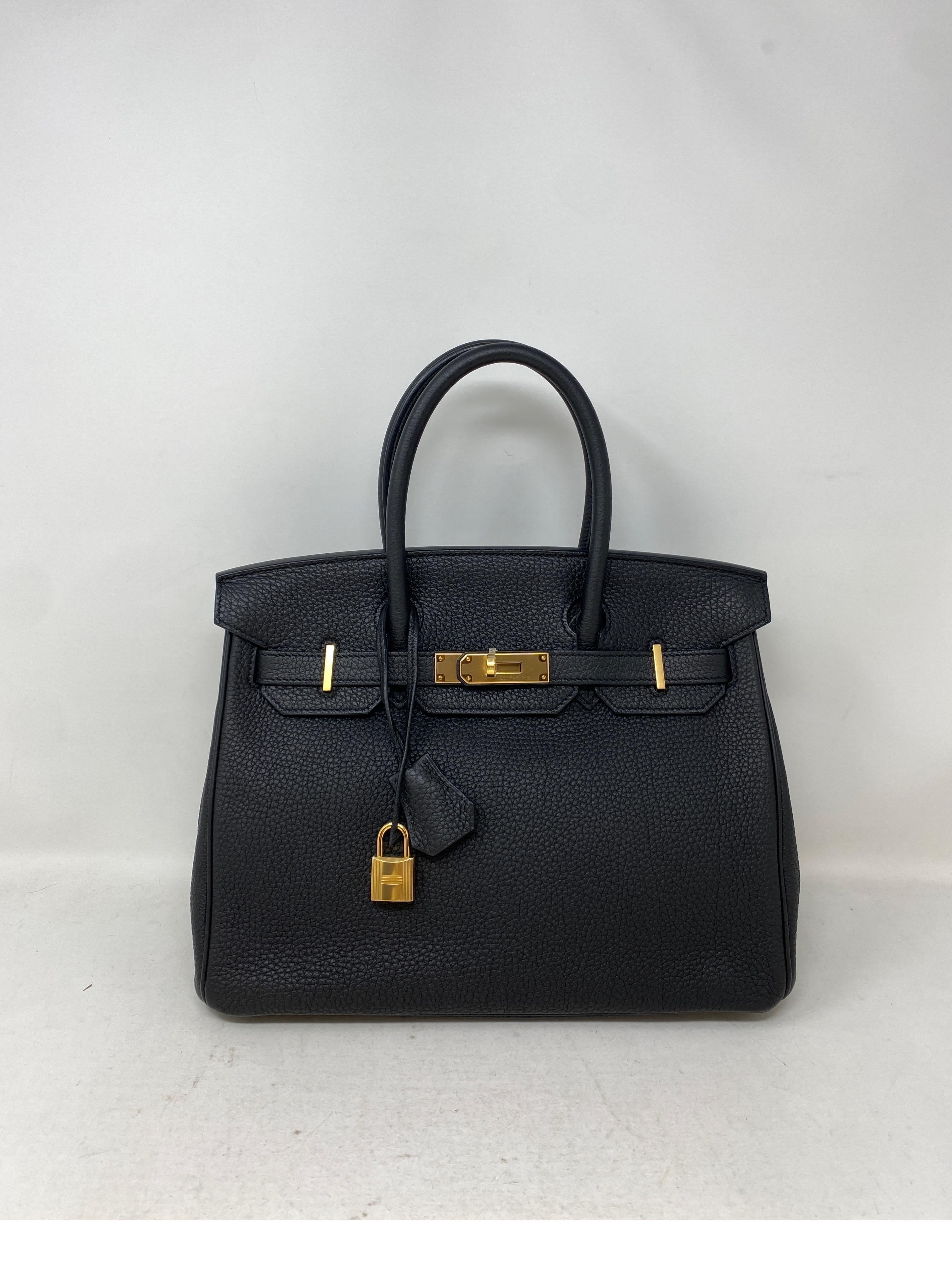 Hermes Black Birkin 30 Bag. Gold hardware. Most wanted combination. Classic black and gold. Togo leather. Excellent conditon. Like new from 2017. Plastic still on hardware. Best investment bag. Classic size 30. Includes clochette, lock, keys, and