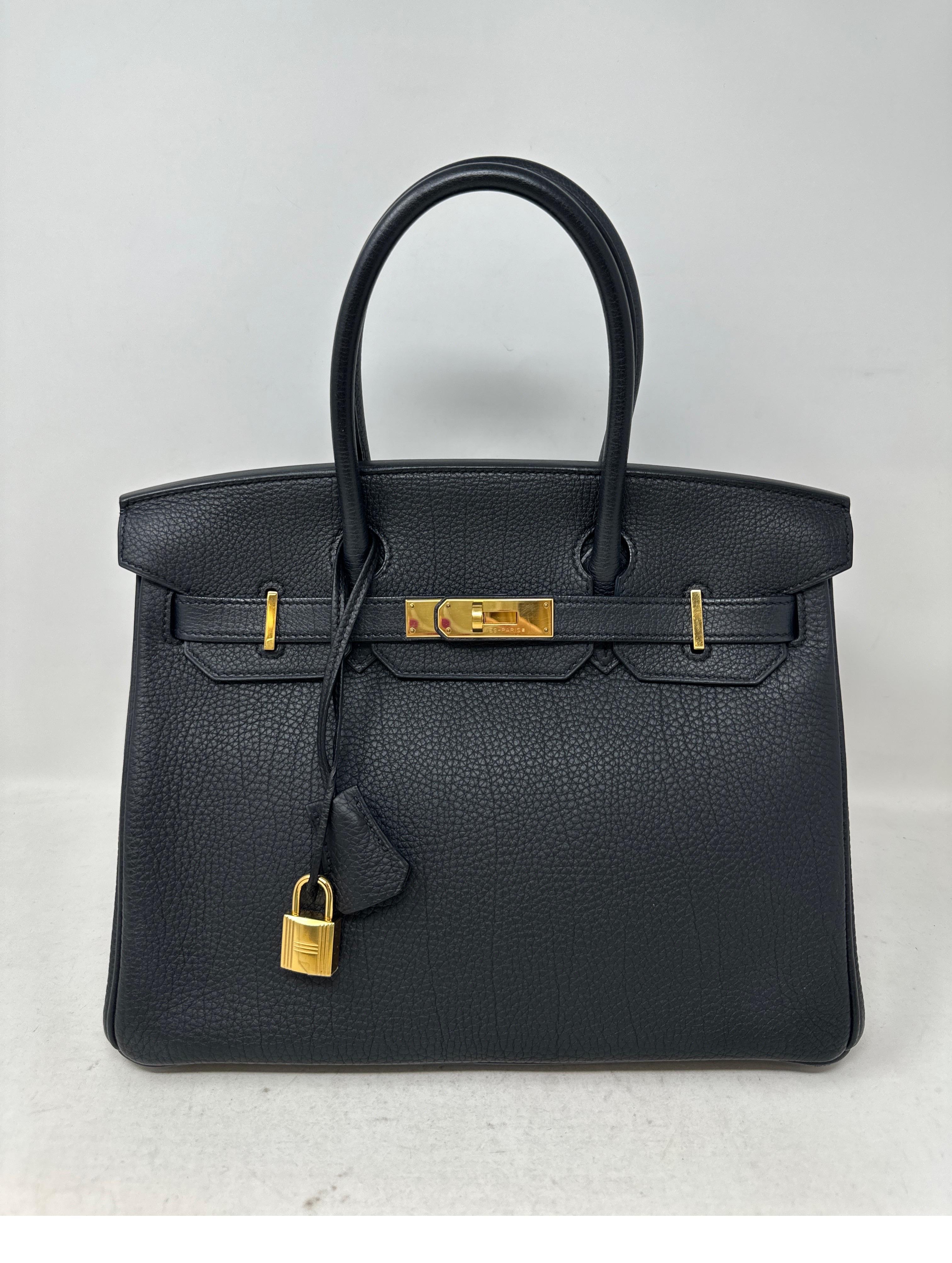 Hermes Black Birkin 30 Bag. Excellent condition togo leather Birkin. Gold hardware. The most wanted combination color and size. Full set. Includes clochette, lock, keys, and dust bag and box. Guaranteed authentic. Don't miss out. 