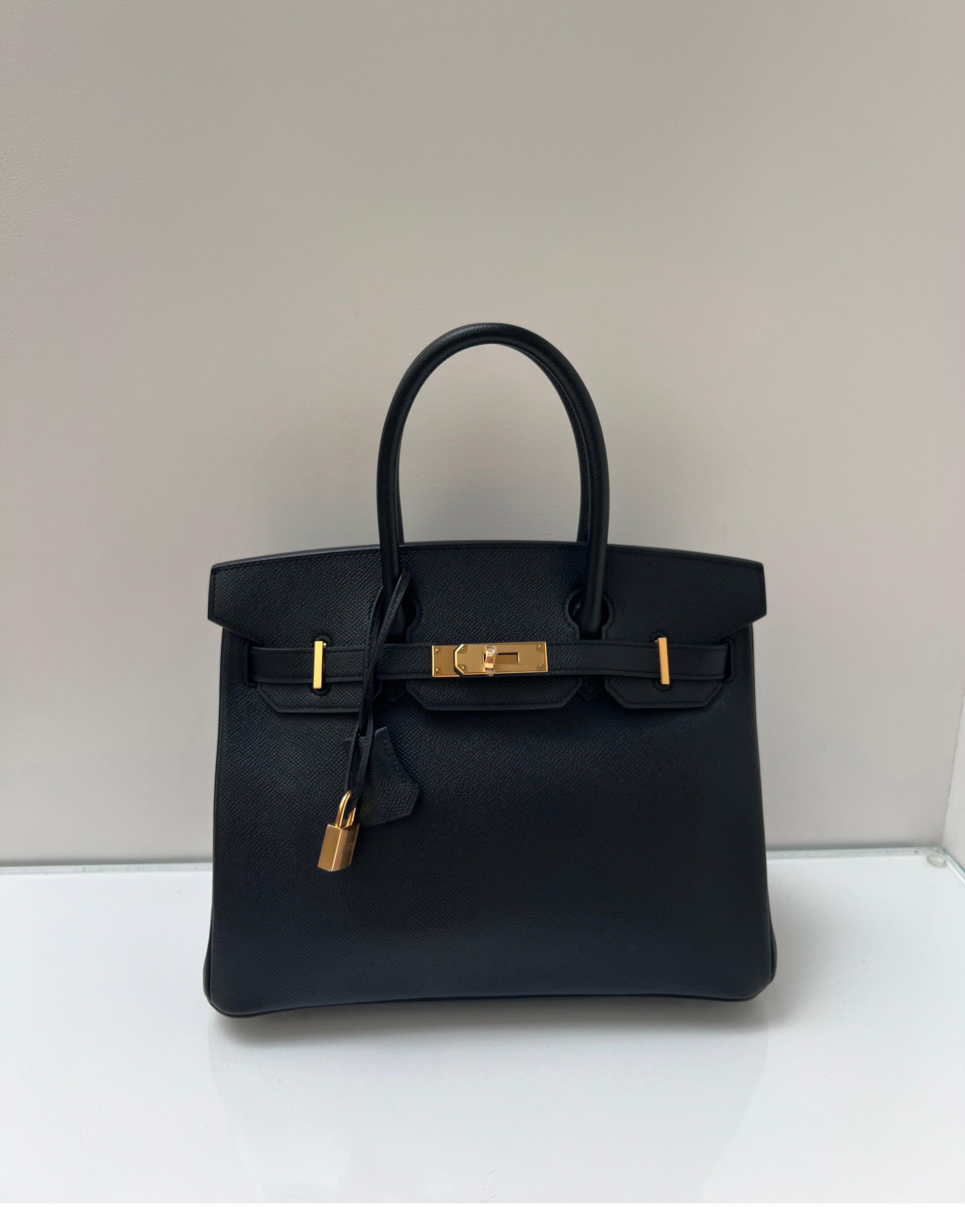 Hermes Black Birkin 30 Bag. Excellent like new condition. Plastic is still on hardware. Looks unused. Gift worthy. Gold hardware. Epsom leather. Newer bag. Includes clochette, lock, keys, and dust bag. Guaranteed authentic. Great investment bag. 