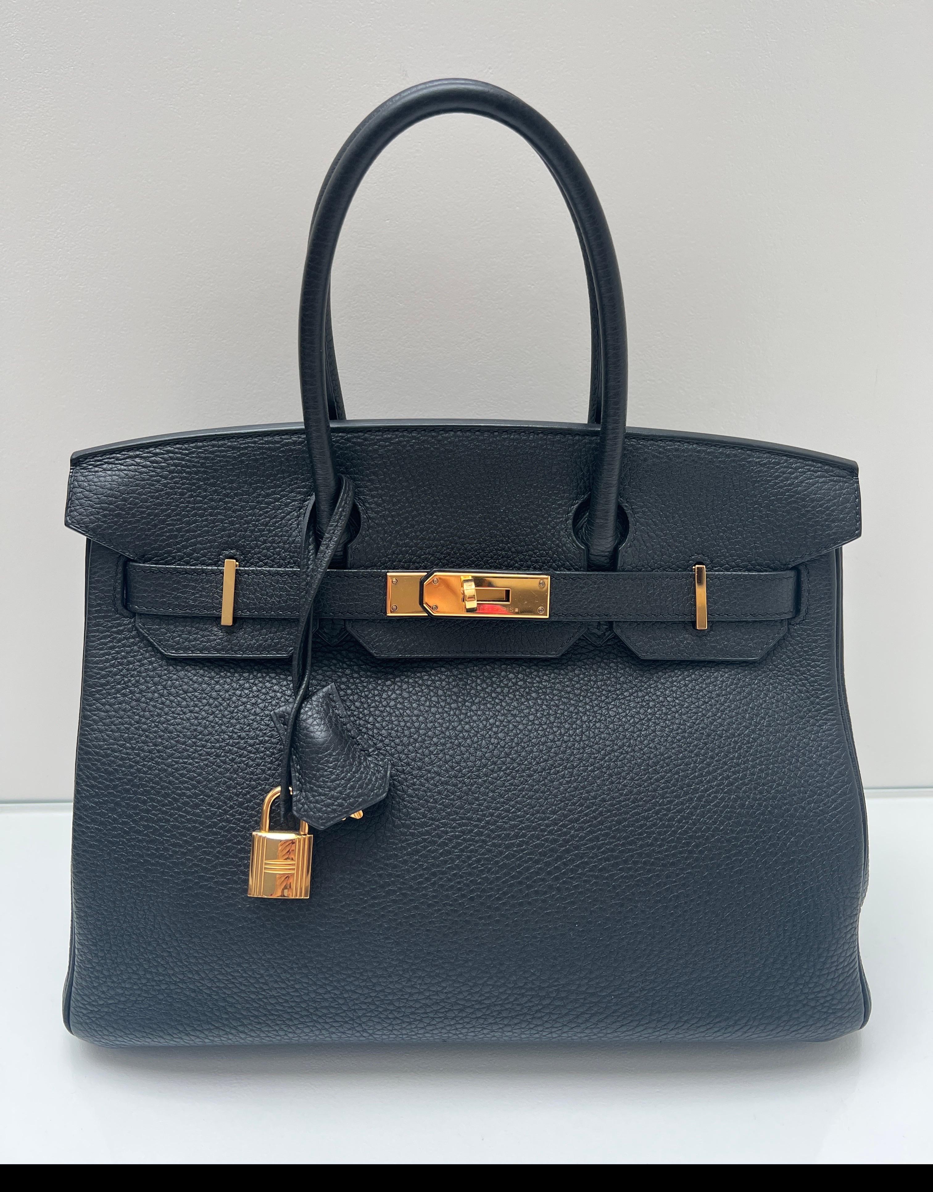 Hermes Black Birkin 30 Bag. Excellent condition. Looks like was never used. Black togo leather with gold hardware. Interior clean. Black is the most wanted and 30 size is highly desired. Includes clochette, lock, keys, and dust bag. Guaranteed
