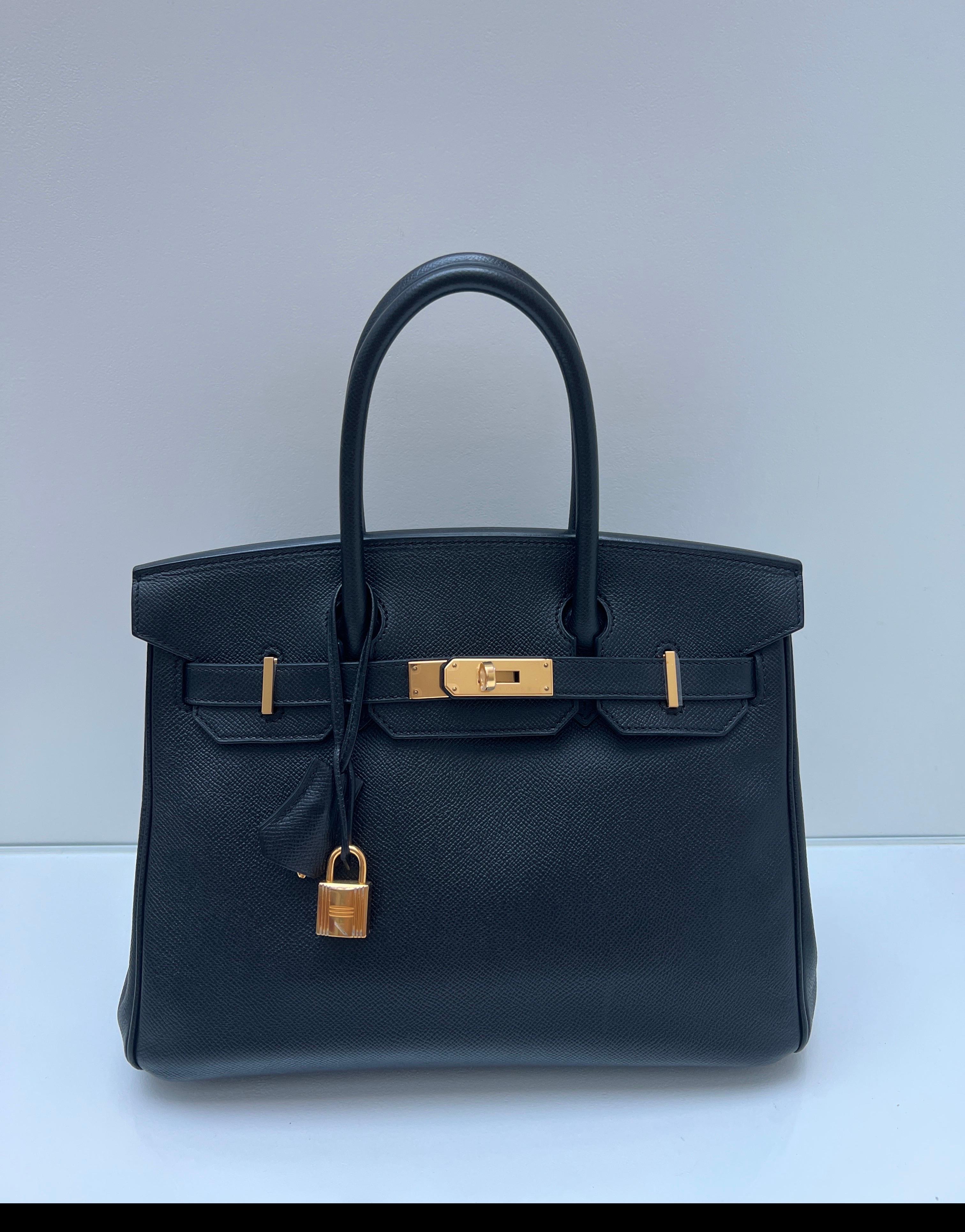 Hermes Black Birkin 30 Bag. Epsom leather. Gold hardware. Excellent condition. Interior clean. Includes clochette, lock, keys, and dust bag. Newer bag. Guaranteed authentic. 