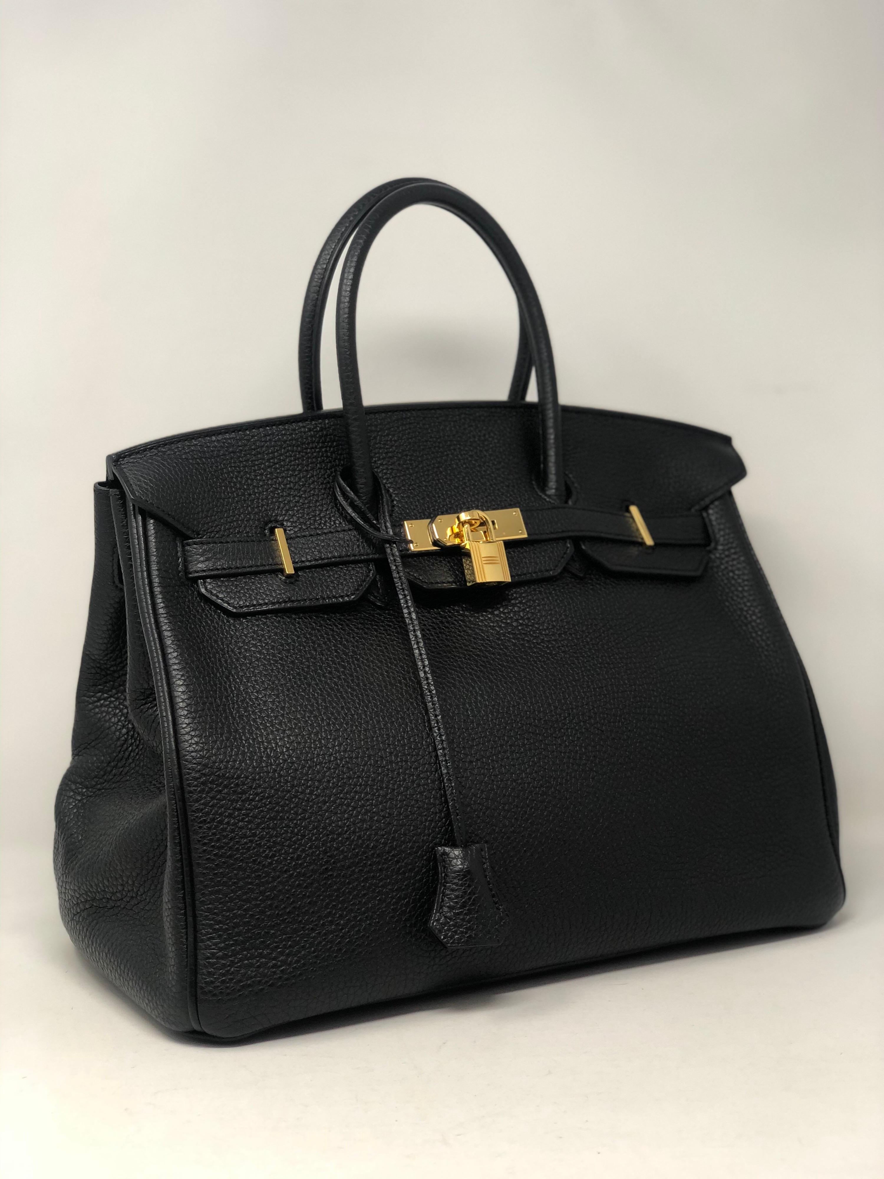 Hermes Black Birkin 35. Gold hardware. M square stamp. From 2009. Excellent condition. Most sought after black with gold hardware. Don't miss out. Includes clochette, lock, keys, and dust cover. Guaranteed authentic. 