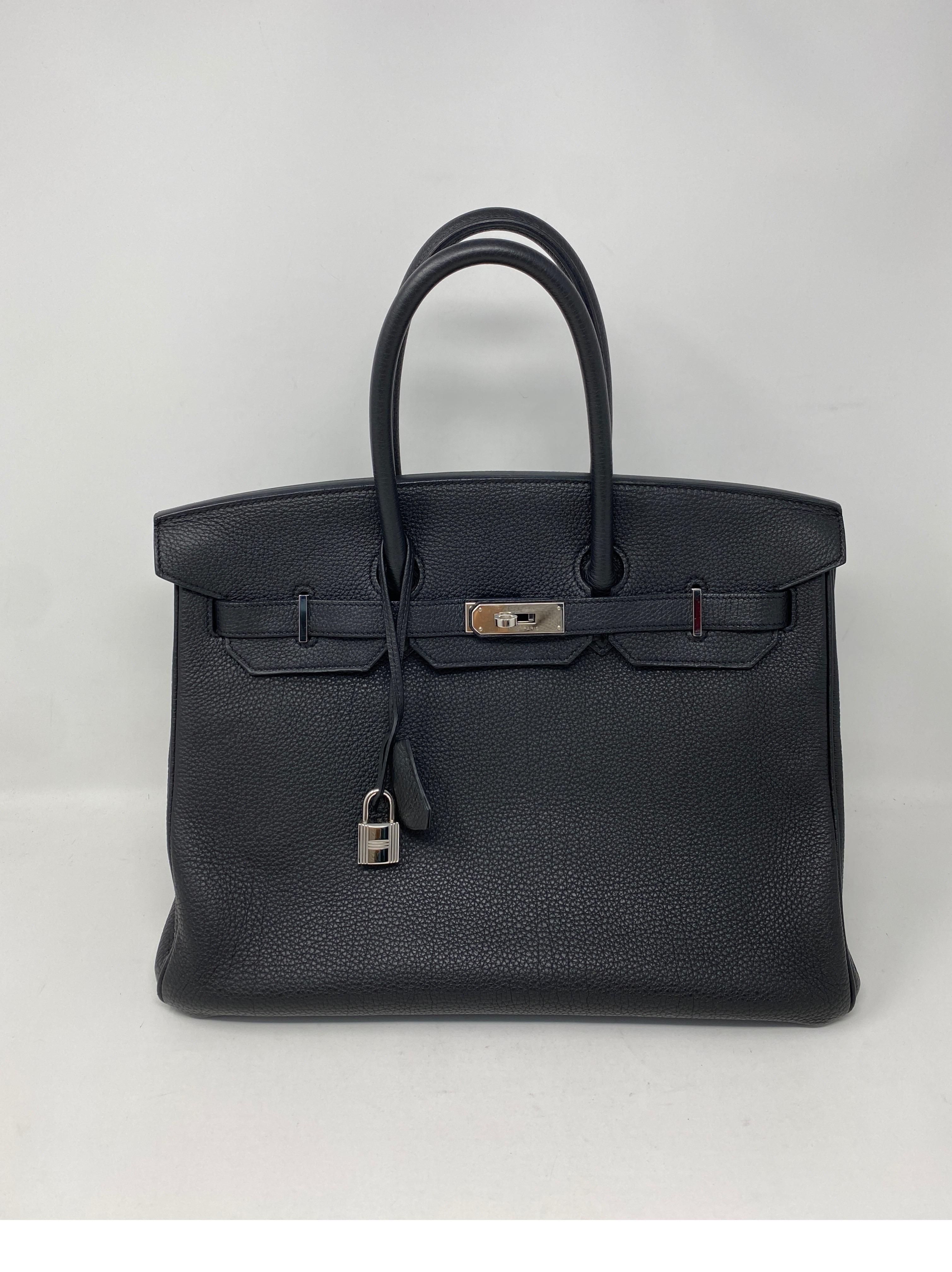 Hermes Black Birkin 35 Bag. Black togo leather with palladium hardware. Excellent condition. Classic most wanted black color. Includes clochette, lock, keys, dust cover and insert included. Light perfume scent interior. Clean throughout bag.