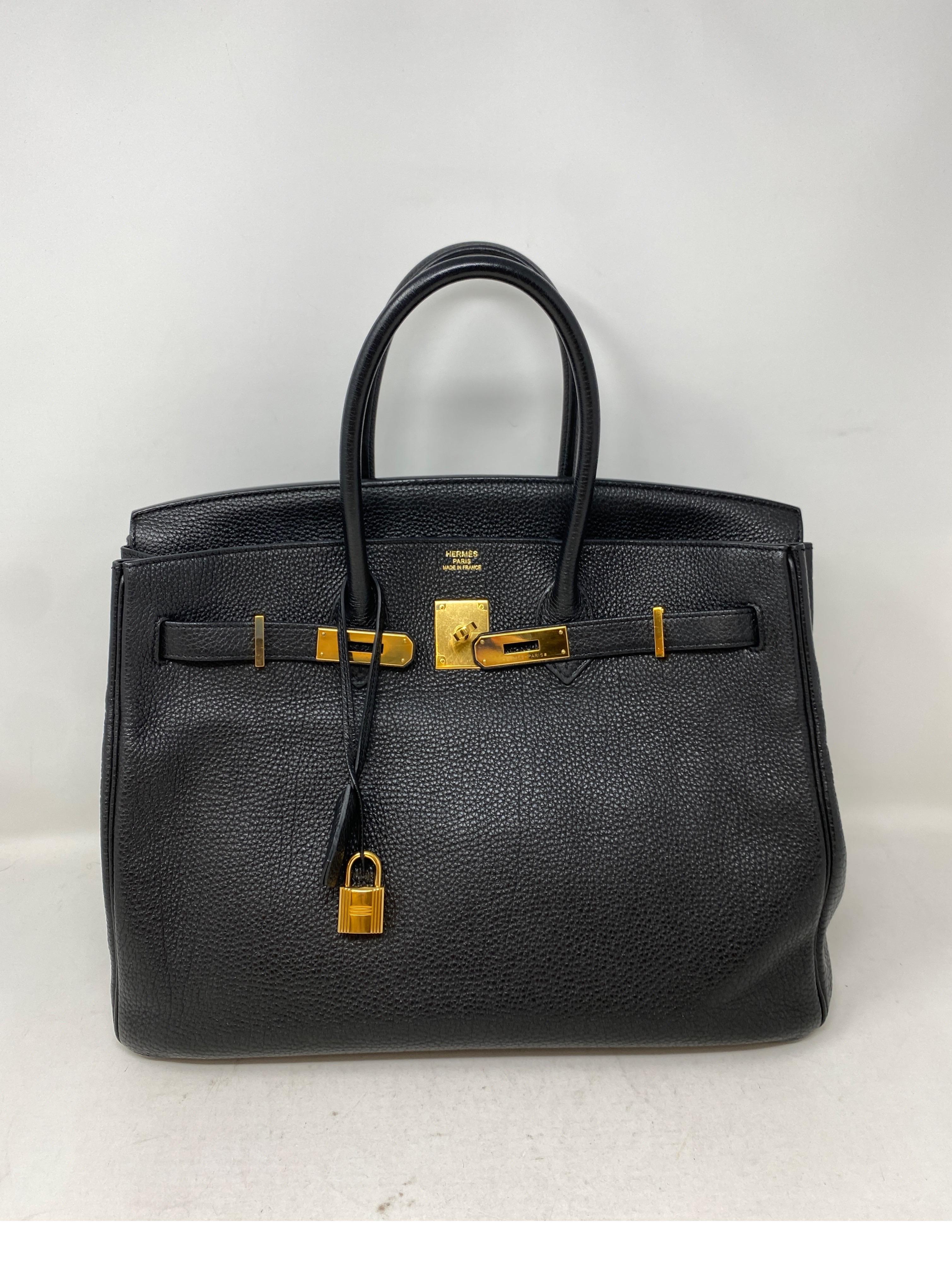 Hermes Black Birkin 35 Bag. Gold hardware. Excellent condition. Togo leather. Most desired black and gold combination. Classic investment bag. Includes clochette, lock, keys, and dust cover. Guaranteed authentic. 