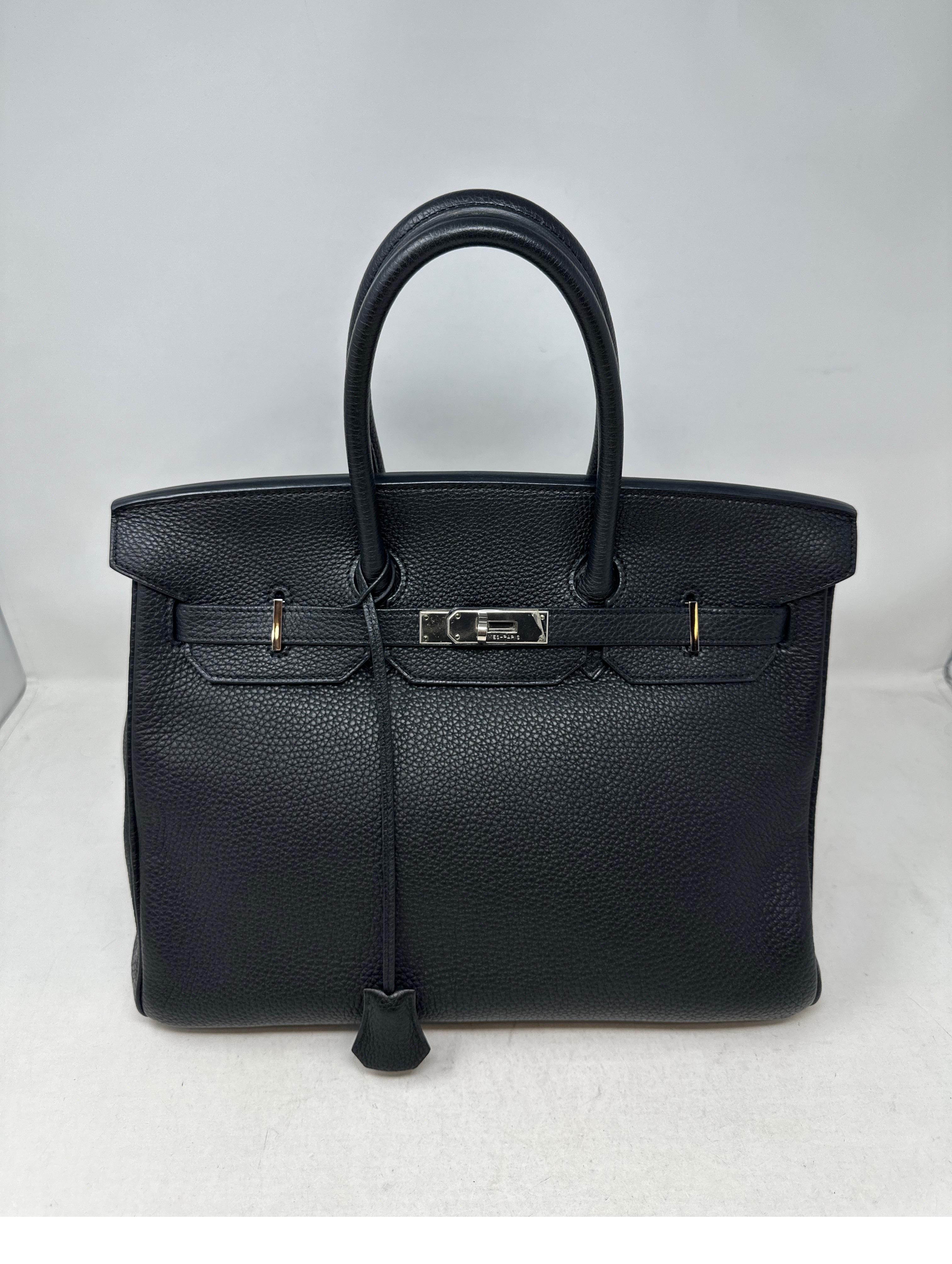 Hermes Black Birkin 35 Bag. Classic black with palladium silver hardware. Excellent condition. Togo leather. Interior clean. Includes clochette, lock, keys, and dust bag. Guaranteed authentic. 