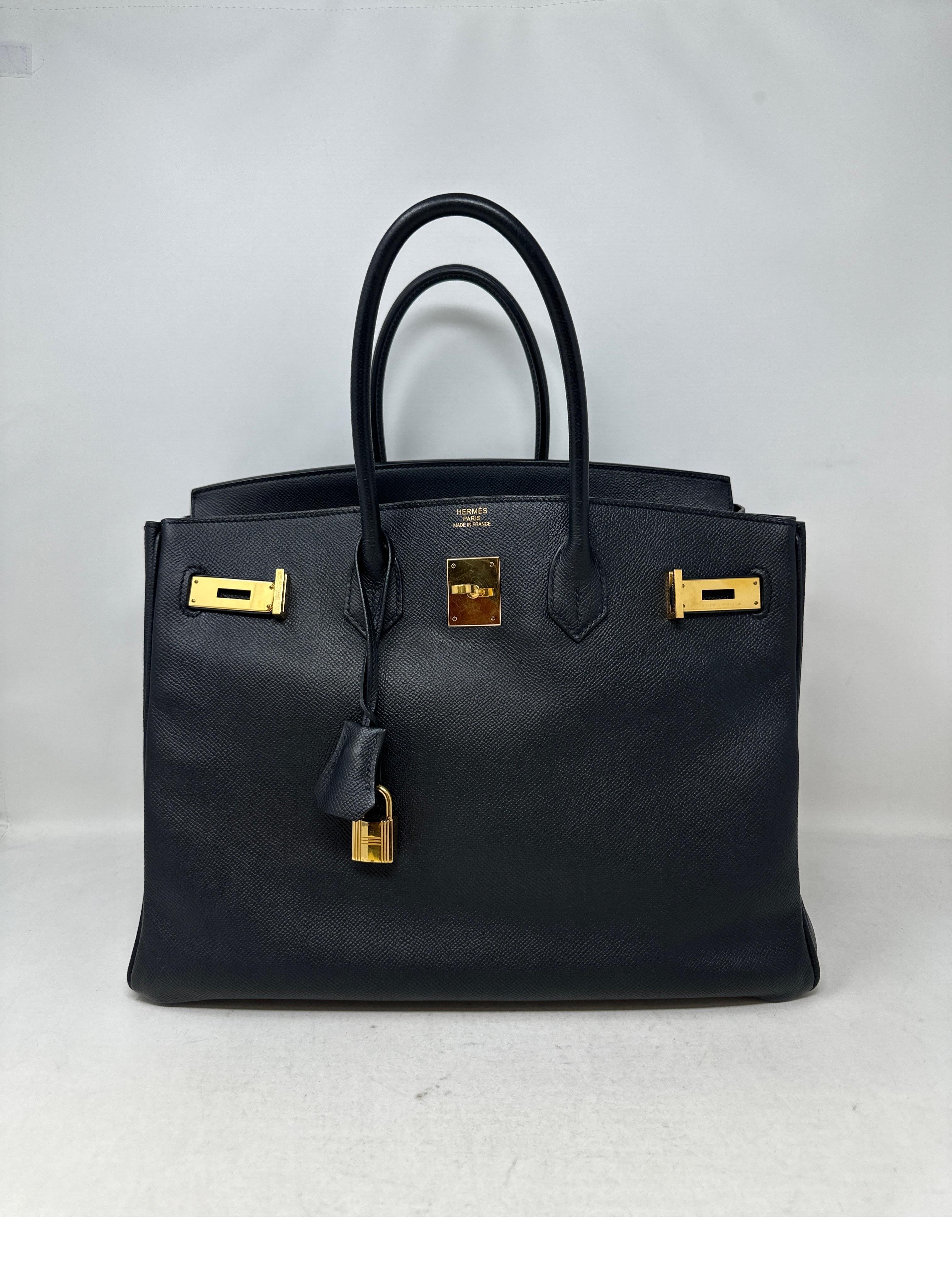 Hermes Black Birkin 35 Bag. Gold hardware. Excellent condition. Epsom leather. Interior clean. Classic black and gold combination.  Includes clochette, lock, keys, and dust bag. Guaranteed authentic. 