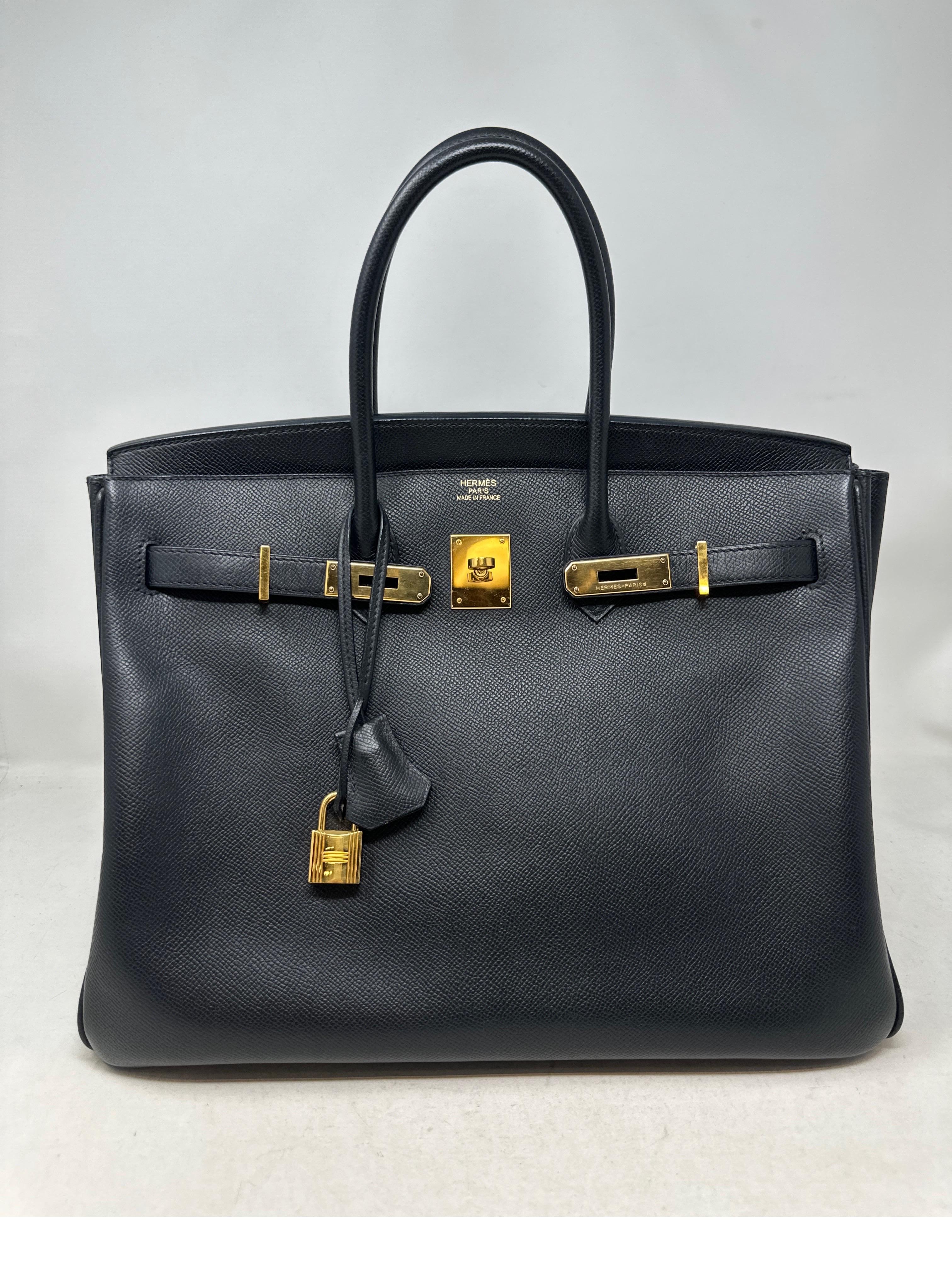 Hermes Black Birkin 35 Bag. Epsom leather. Excellent like new condition. Gold hardware. Interior clean. Includes clochette, lock, keys, and dust bag. Guaranteed authentic. Beautiful classic black bag. Investment piece. 