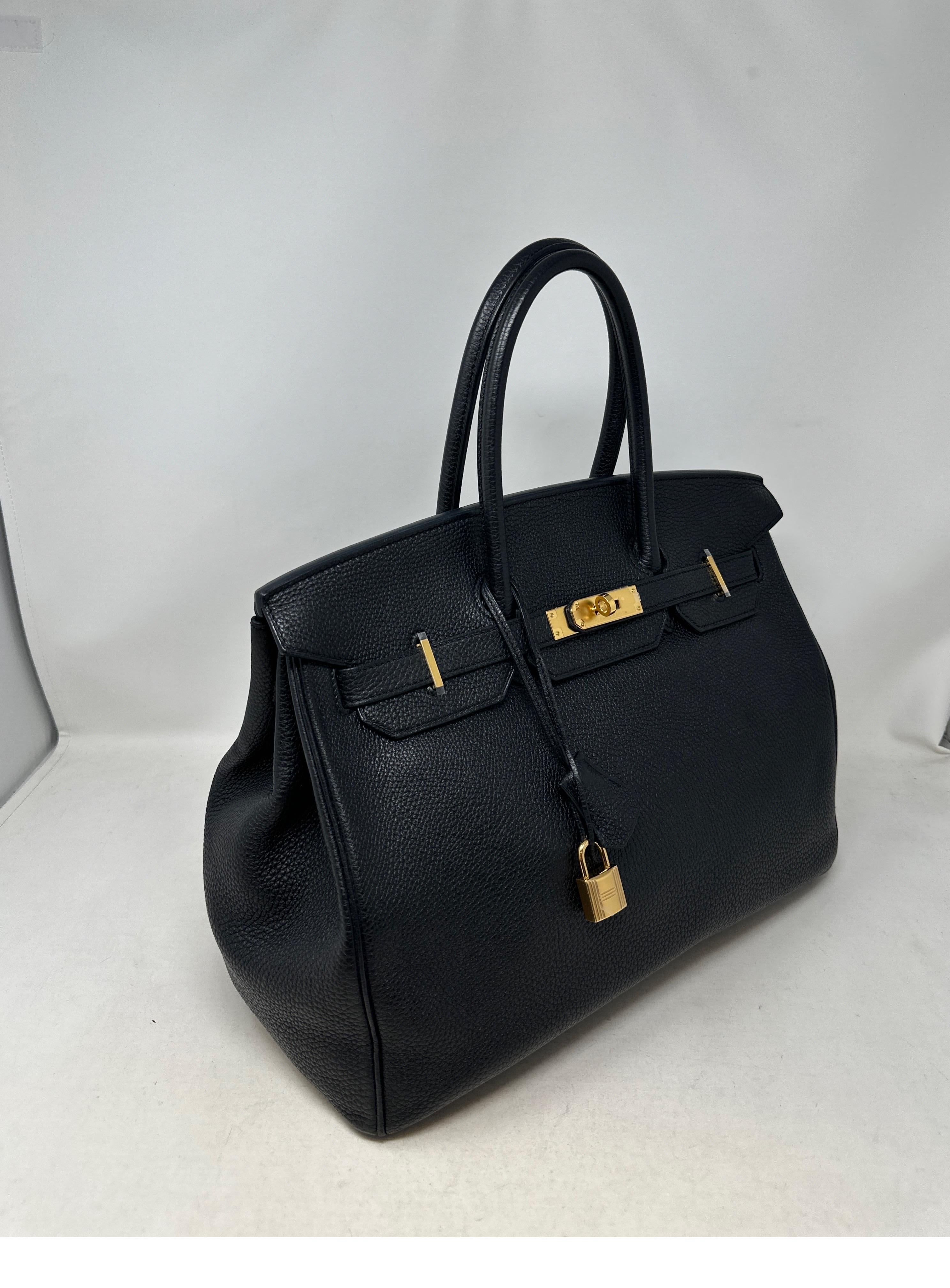 Hermes Black Birkin 35 Bag. Togo leather. Excellent condition. Gold hardware. Plastic is still on the hardware. Interior is clean. The bag looks like new condition. The most wanted combination. Black with gold hardware. Great investment bag.