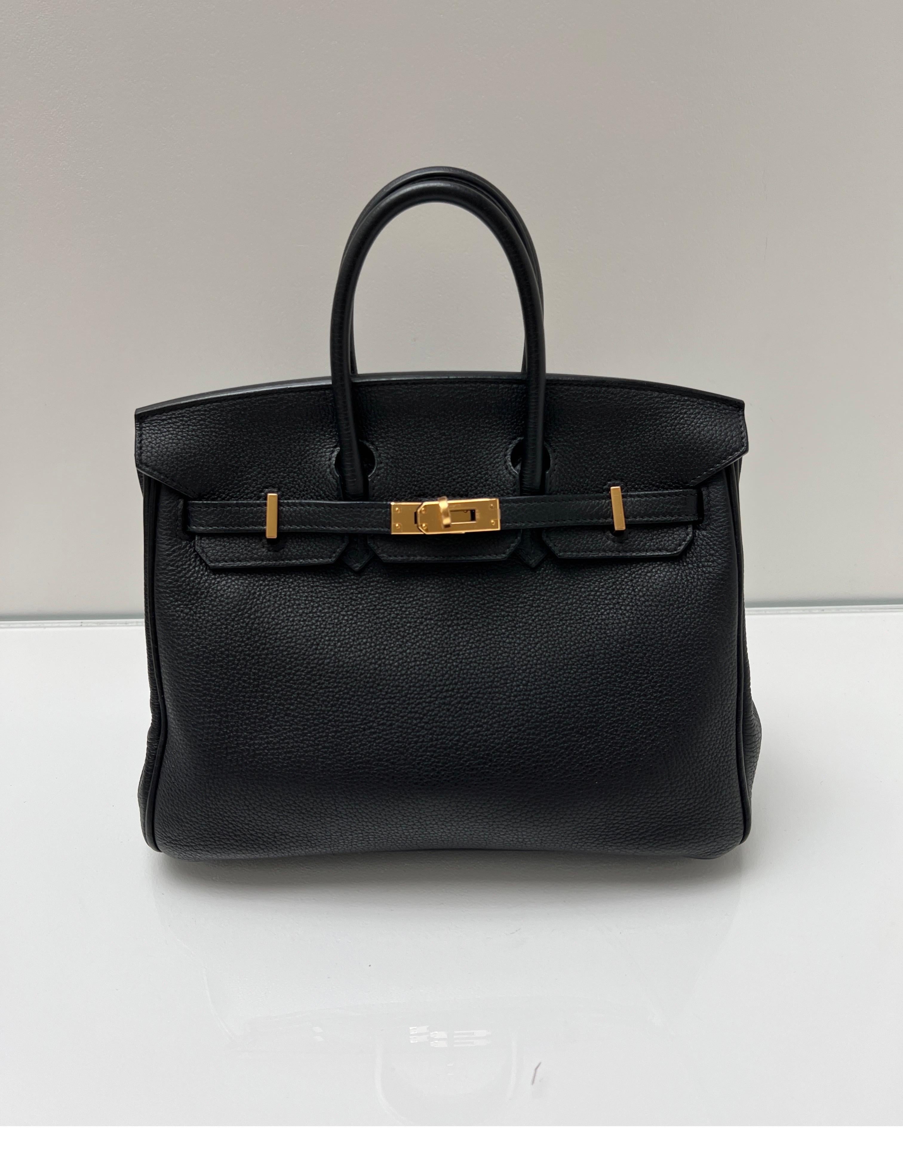 Hermes Black Birkin 35 Bag. Excellent like new condition. Plastic is still on hardware. Interior clean. Gold hardware. Most wanted black and gold combination. Classic bag. Great investment bag. Includes clochette, lock, keys, and dust bag.
