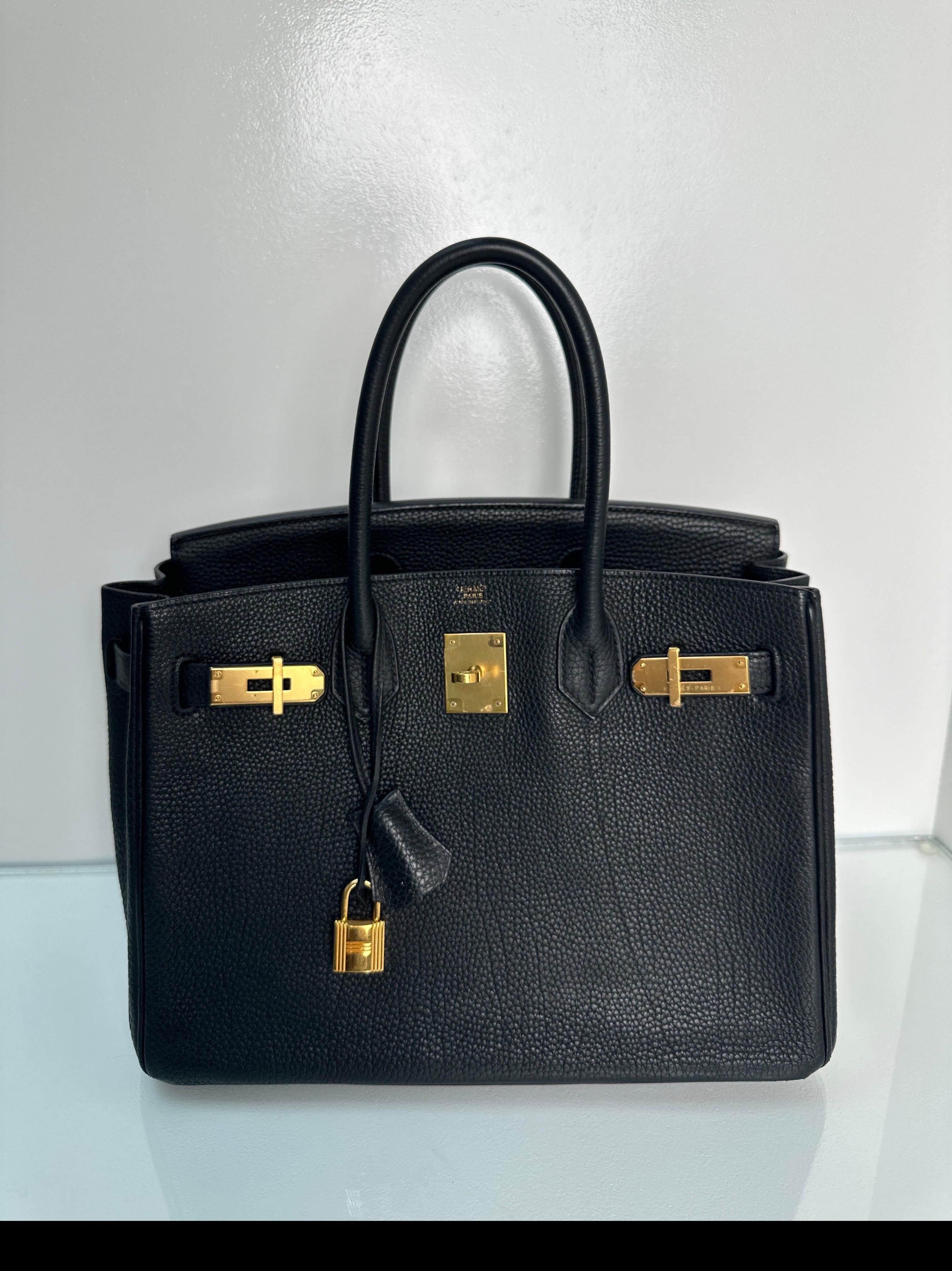 Hermes Black Birkin 35 Bag. Vintage Birkin in excellent condition. Gold hardware. Bag looks like it was hardly worn. Interior clean. Classic black with gold. Investment bag. Includes clochette, lock, keys, and dust bag. Guaranteed authentic. 