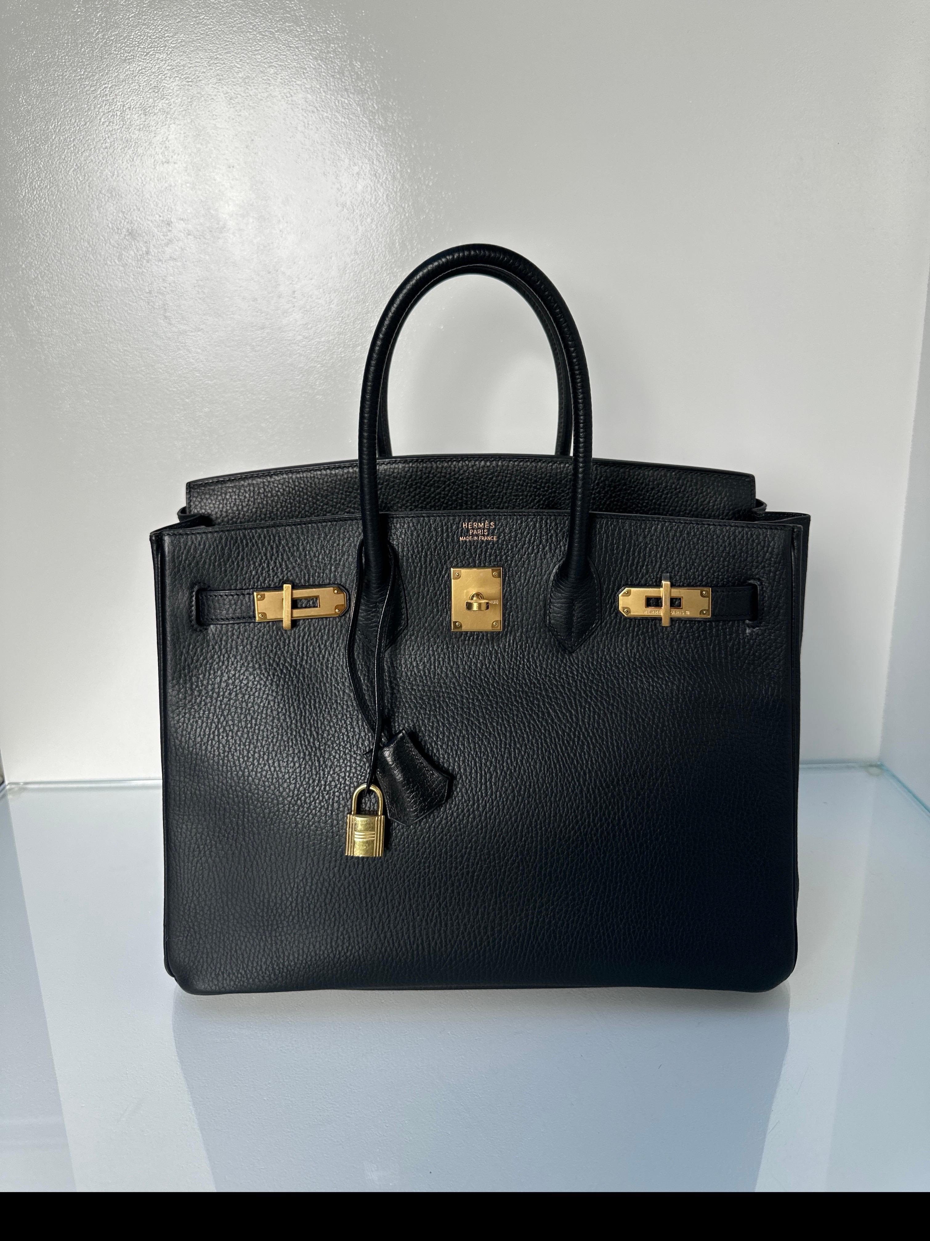 Hermes Black Birkin 35 Bag. Vintage black Birkin with gold hardware. Ardennes leather. Interior clean. Highly sought after leather and in excellent condition. Iconic investment bag. Includes clochette, lock, keys, and dust bag. Guaranteed authentic. 