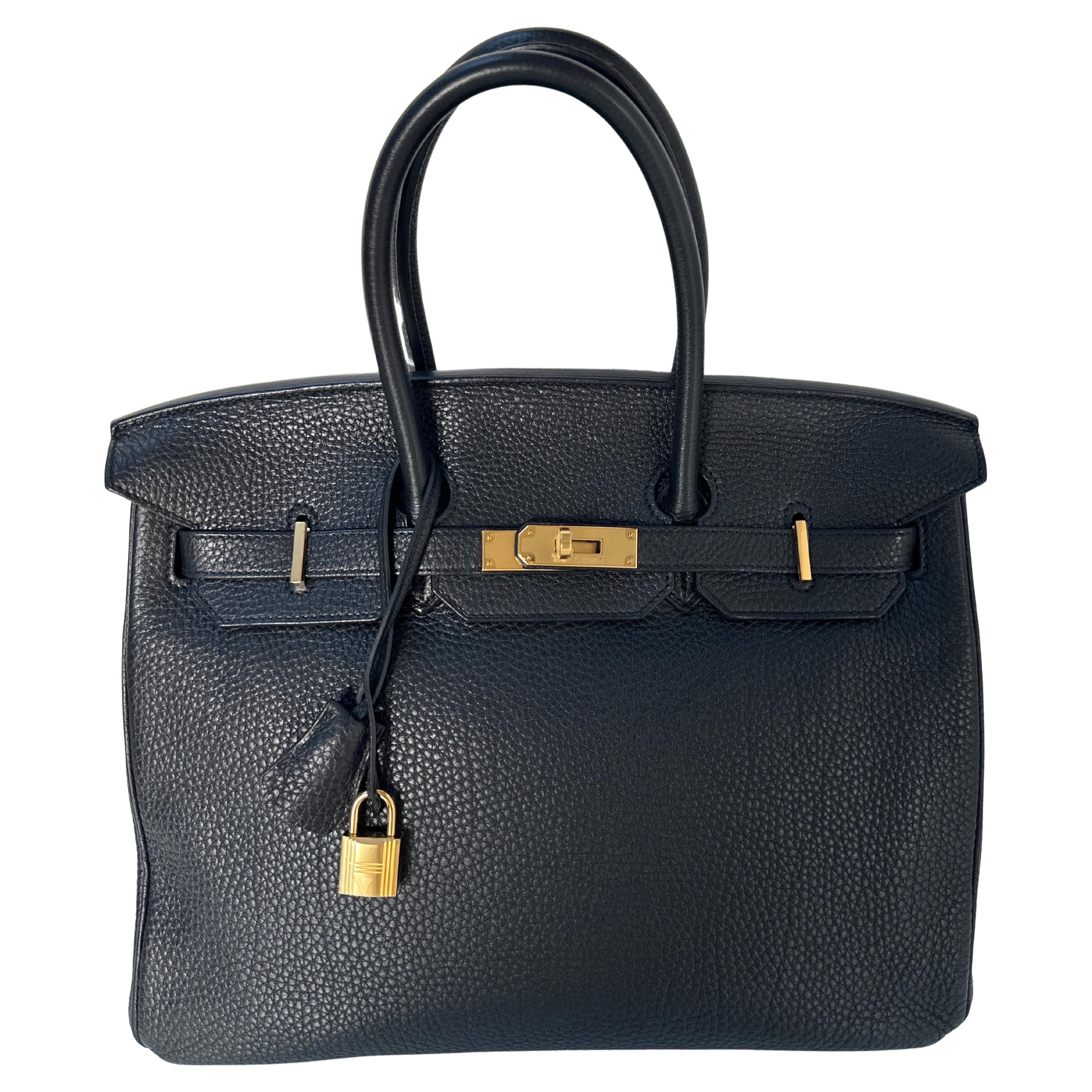 Hermes Black Birkin 35 Bag. Excellent condition. Looks like new with plastic still on hardware. Interior clean. Most wanted combination black with gold hardware. Iconic classic bag. Togo leather. Includes clochette, lock, keys, and dust bag.
