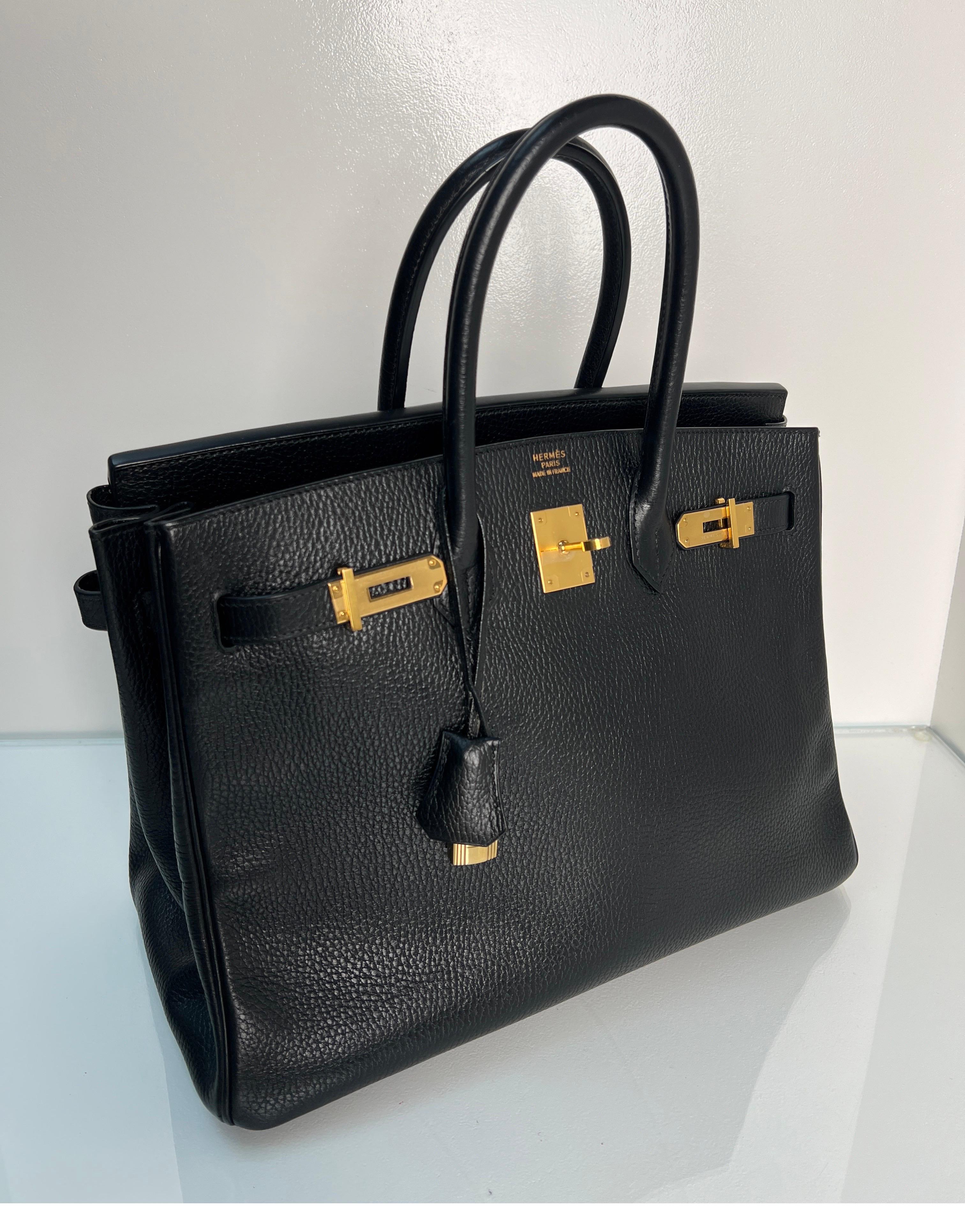 Hermes Black Birkin 35 Bag. Excellent condition. Ardennes leather. Gold hardware. Interior clean. Vintage black Birkin in amazing condition. Plastic is still on the hardware. Highly desired leather. Includes clochette, lock, keys, and dust bag.